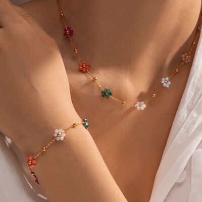 Golden bracelet with multi-colored flowers