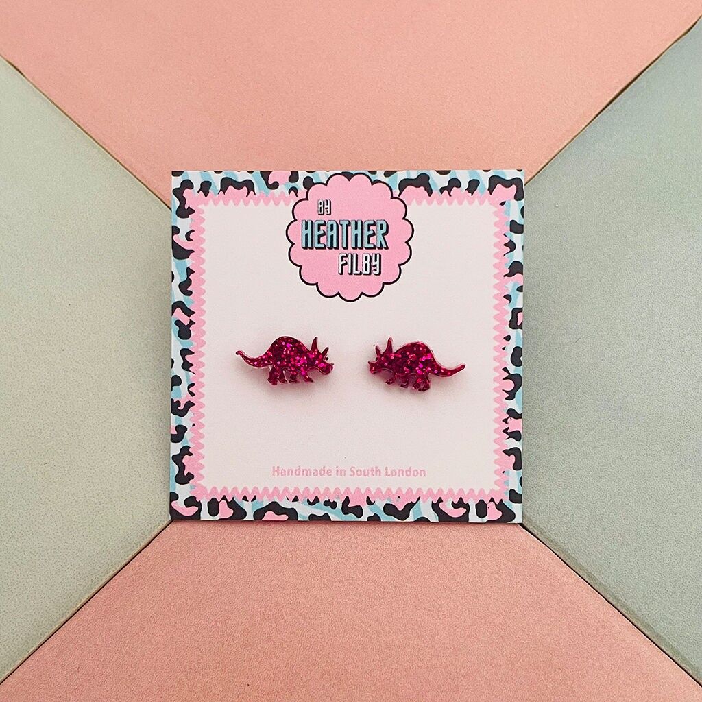 Pinke Glitzer-Ohrstecker mit Dinosaurier-Harz