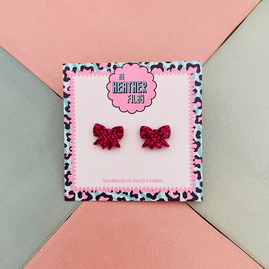 Orecchini a bottone in resina con fiocco glitterato rosa shocking