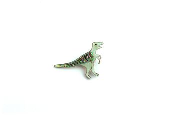 Pin's Pin Velociraptor vert pailleté 4