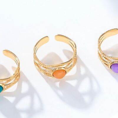 Golden wave ring with orange stone