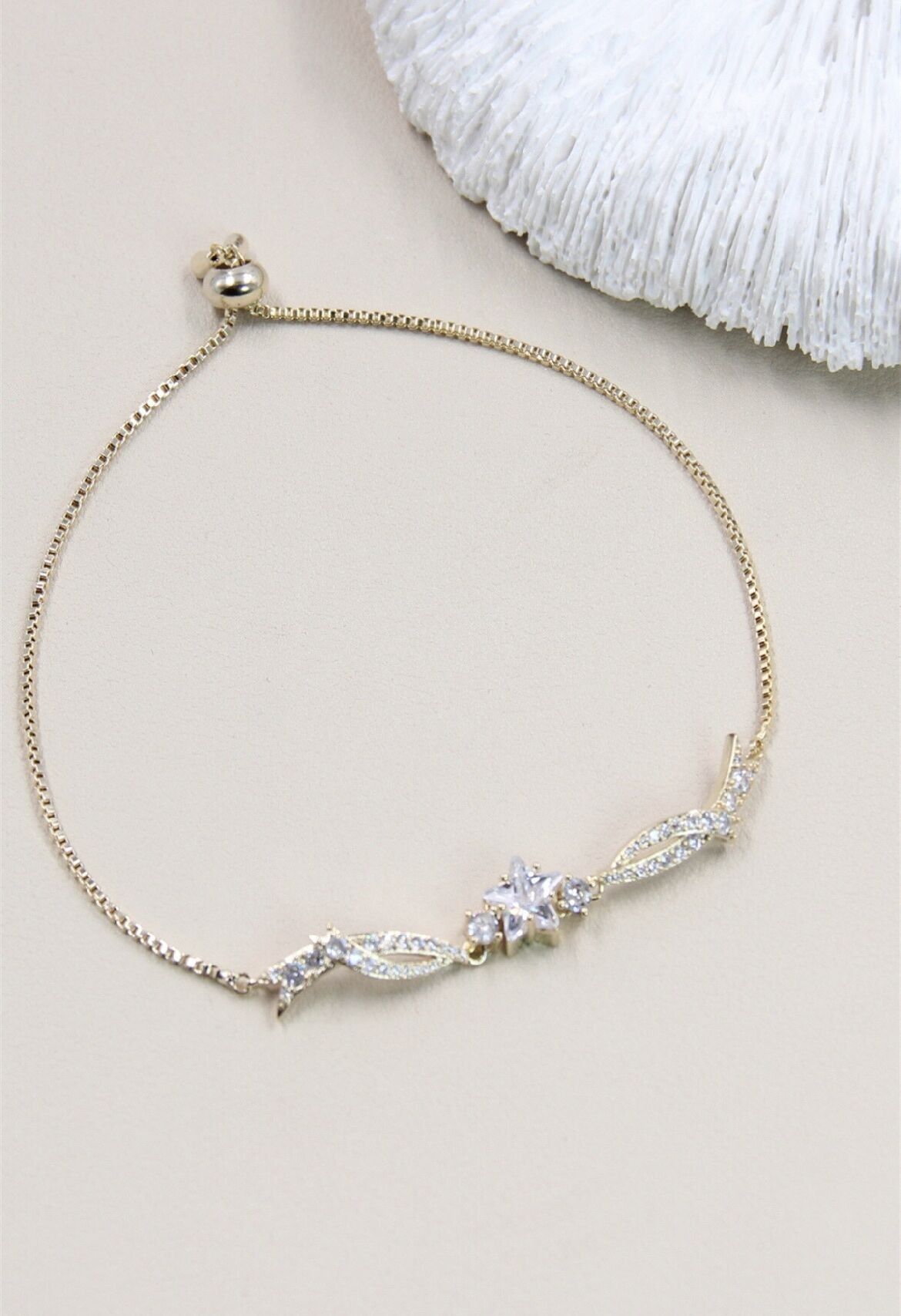 Bracciale scorrevole regolabile a forma di stella decorato con strass