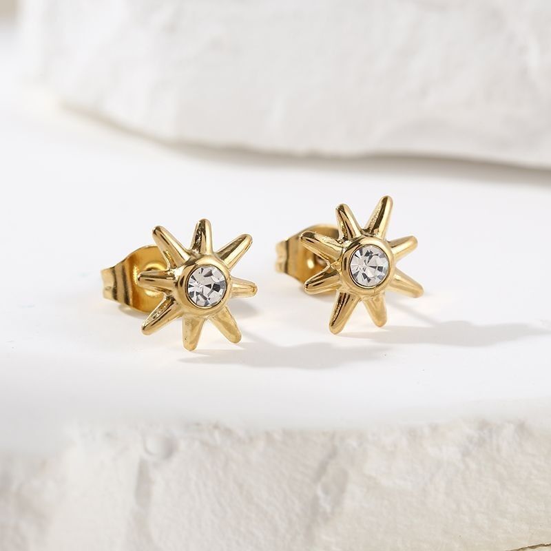 Orecchini a forma di sole dorato con strass