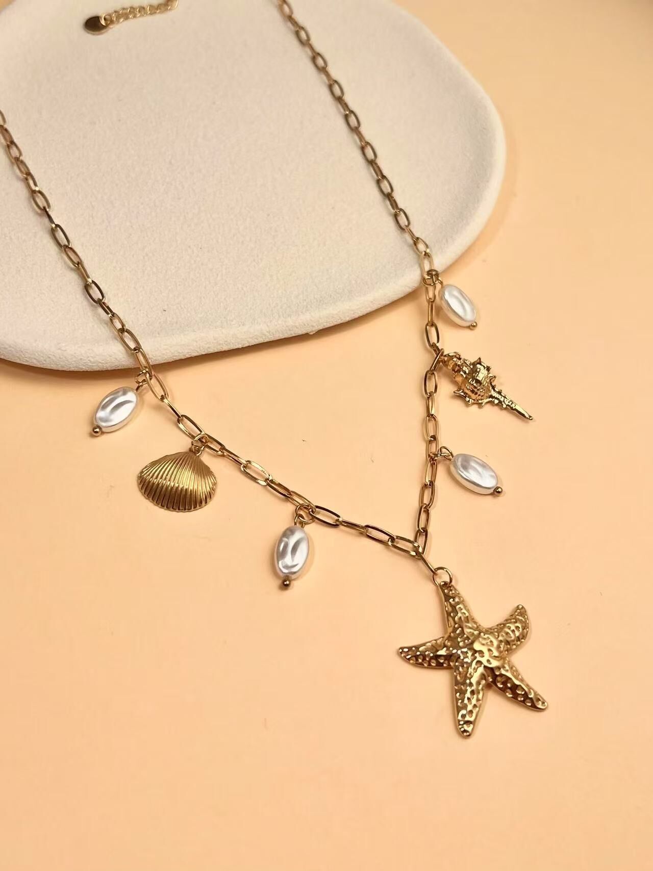 Collana in acciaio inossidabile con ciondoli a forma di stella marina e conchiglia
