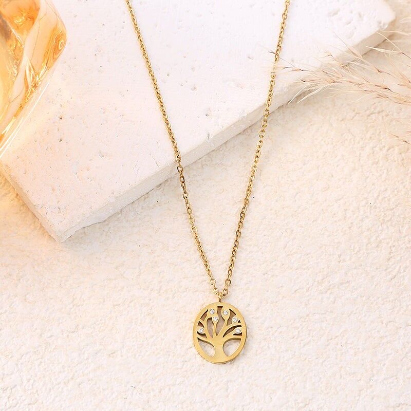 Gold chain necklace with tree of life pendant and rhinestones on the branches