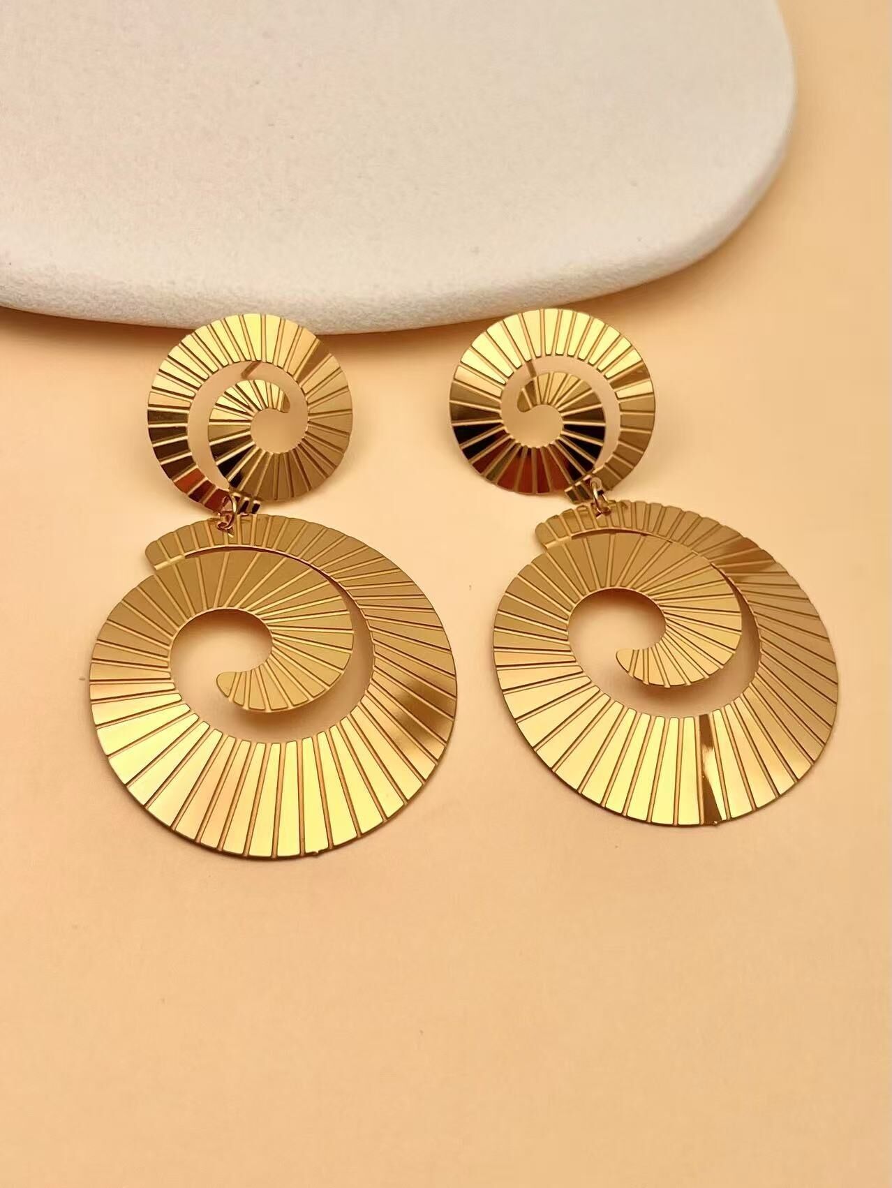 “Solar Spiral” stainless steel earrings