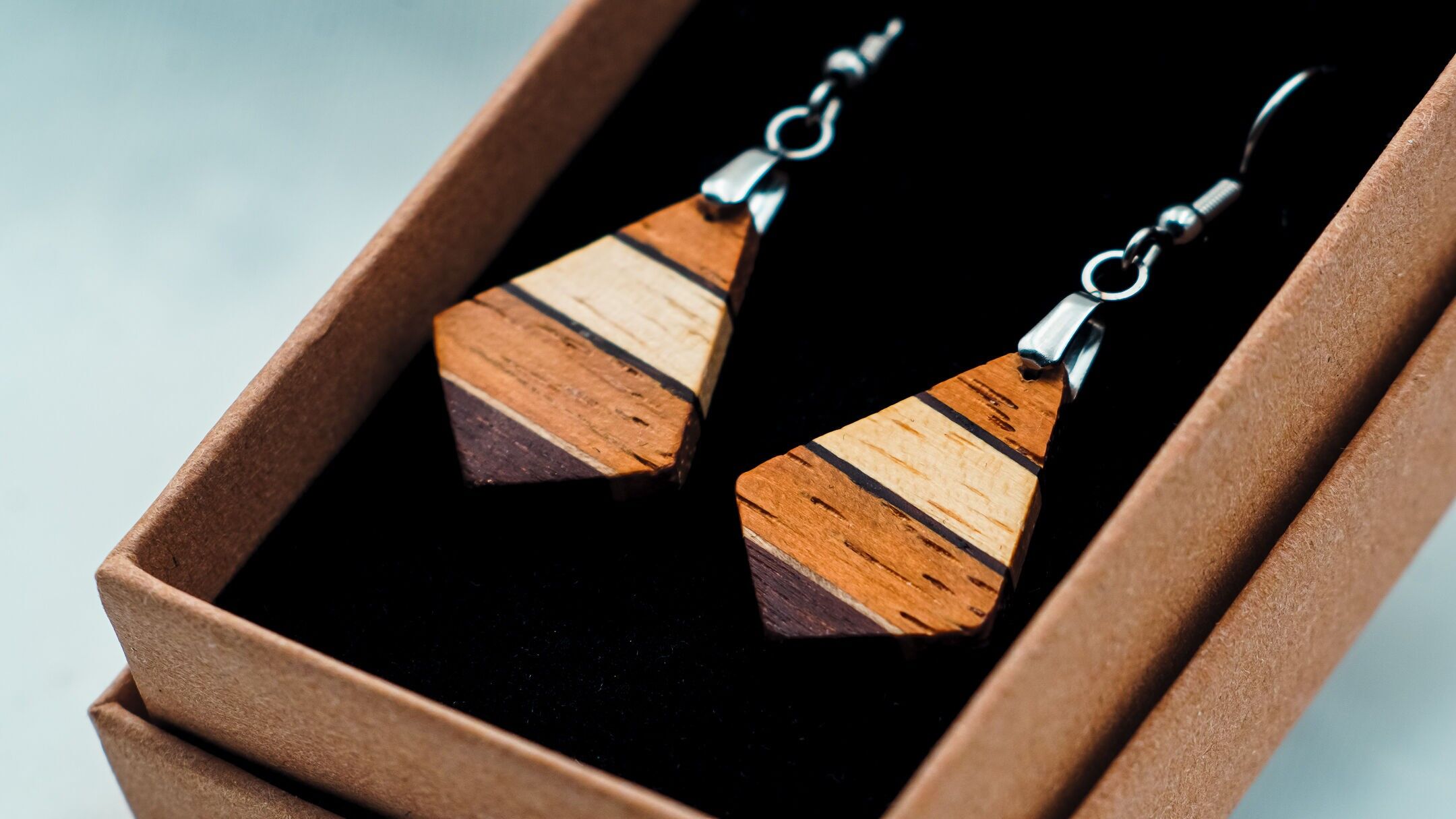 Earrings made from different woods from Guyana.