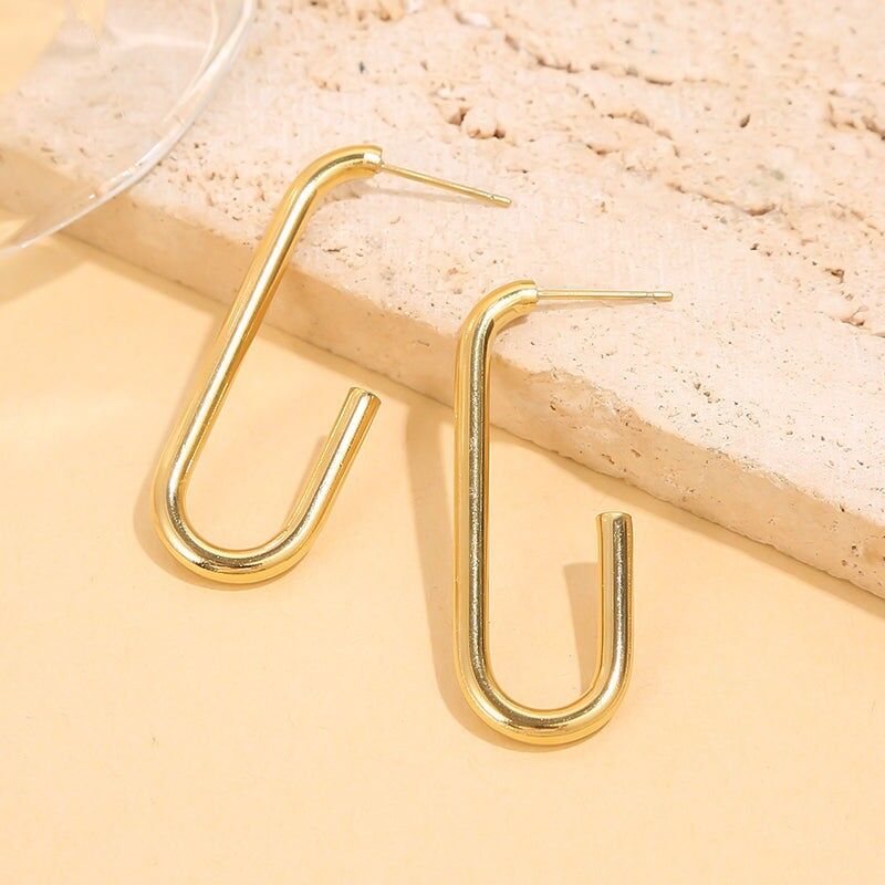 Orecchini a tubo aperti a forma di U in oro