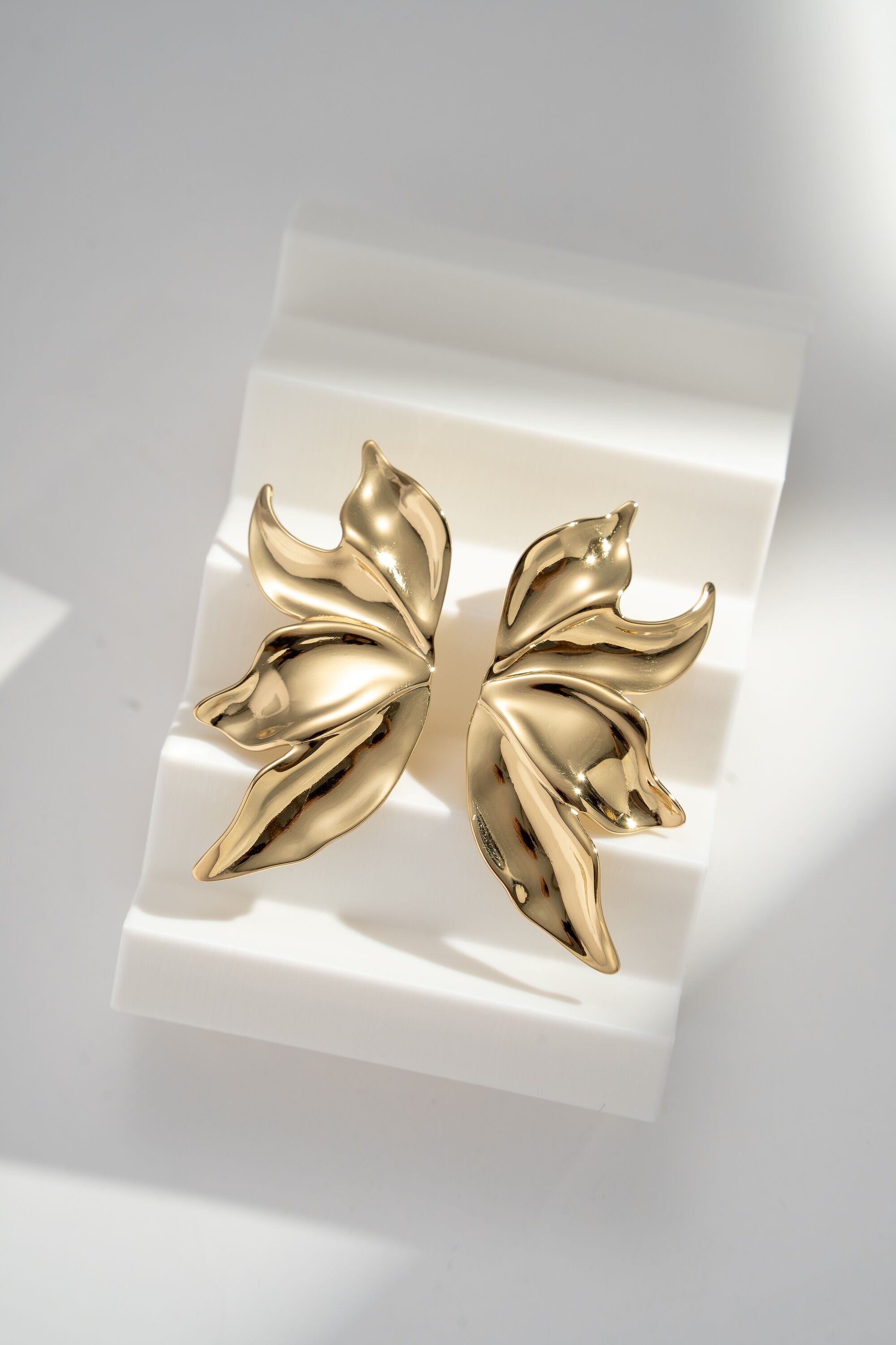 Gold-plated stainless steel sculpted leaf earrings