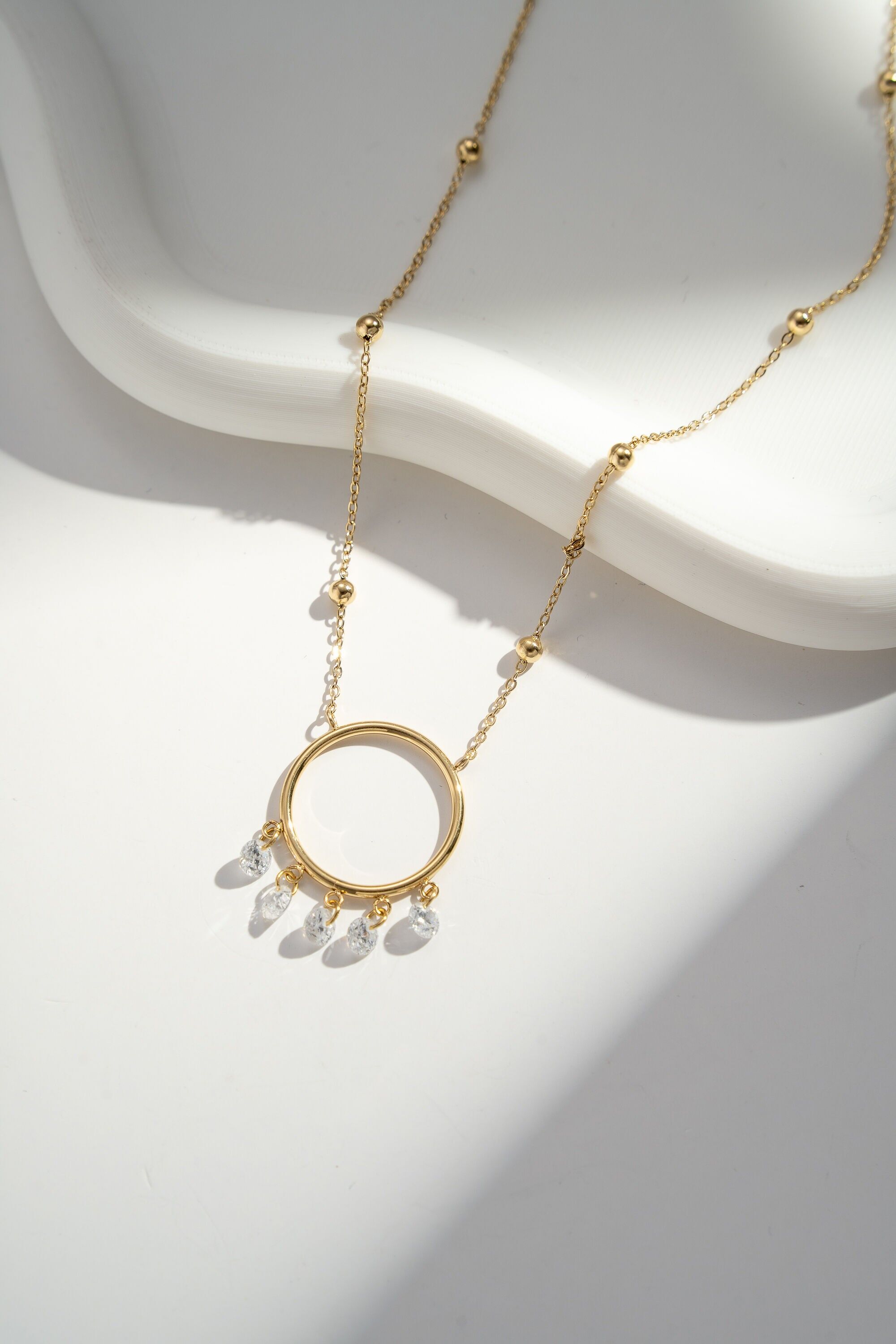 Gold circle necklace with elegant rhinestone pendant and stainless steel