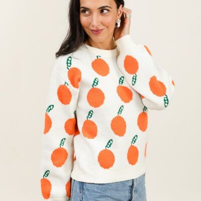 Suéter blanco con estampados naranjas: frescura y originalidad