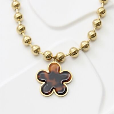 Collar de acero inoxidable con flor dorada y carey: auténtica elegancia