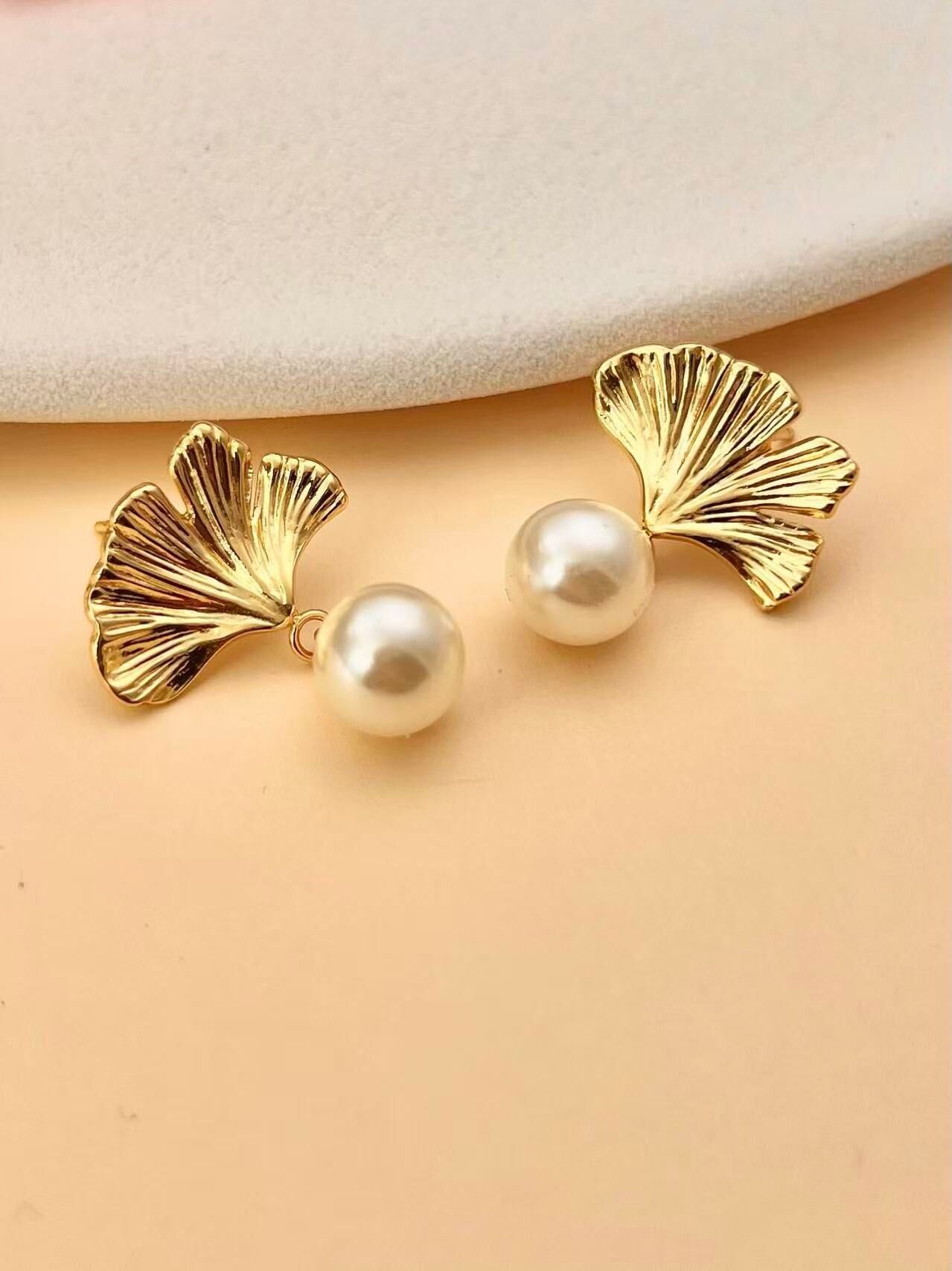 Golden ginkgo leaf earrings with natural pearl
