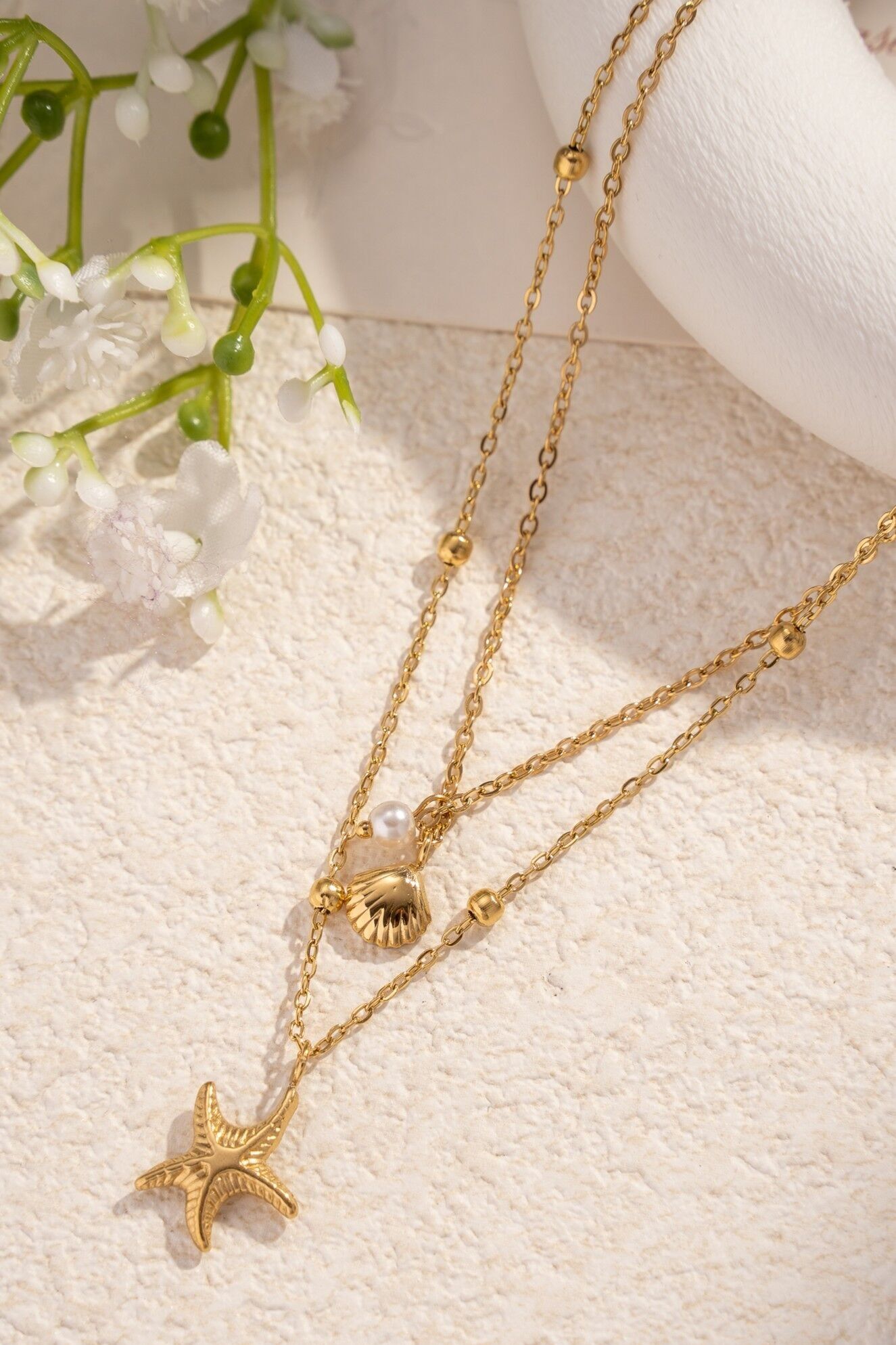 Goldene Doppelkettenhalskette – Seestern- und Hahnmedaillons