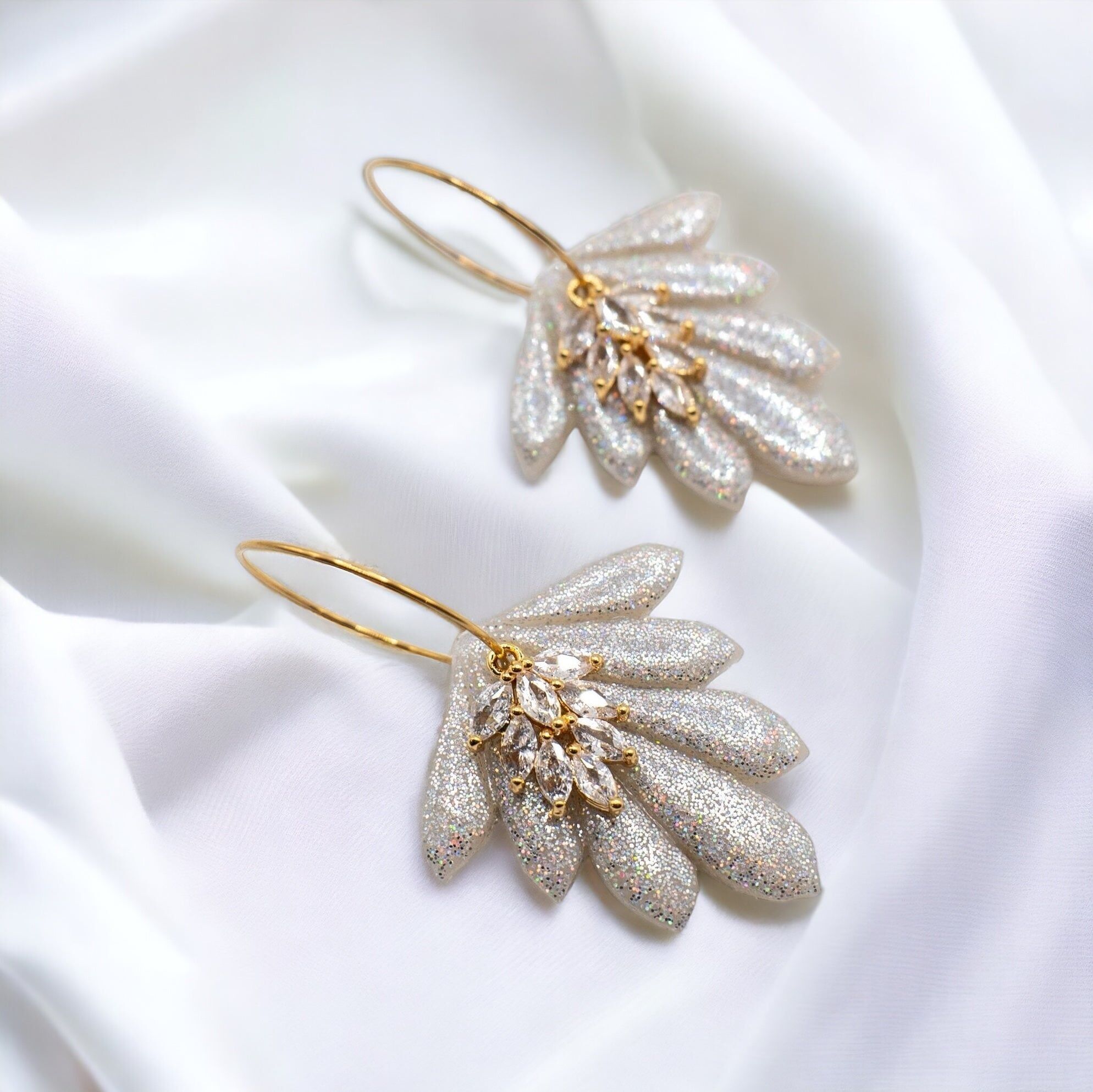 Orecchini con zirconi effetto olografico