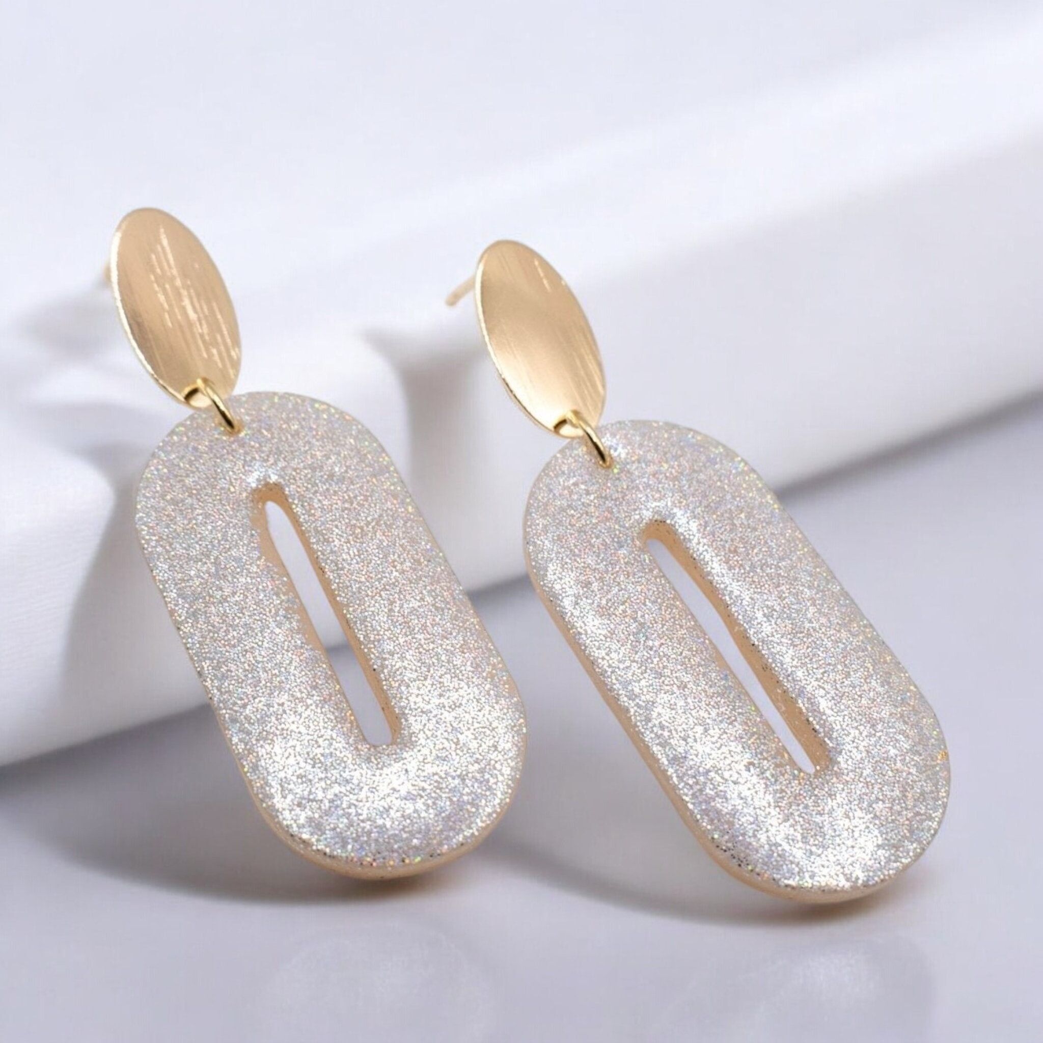 Orecchini ovali effetto olografico