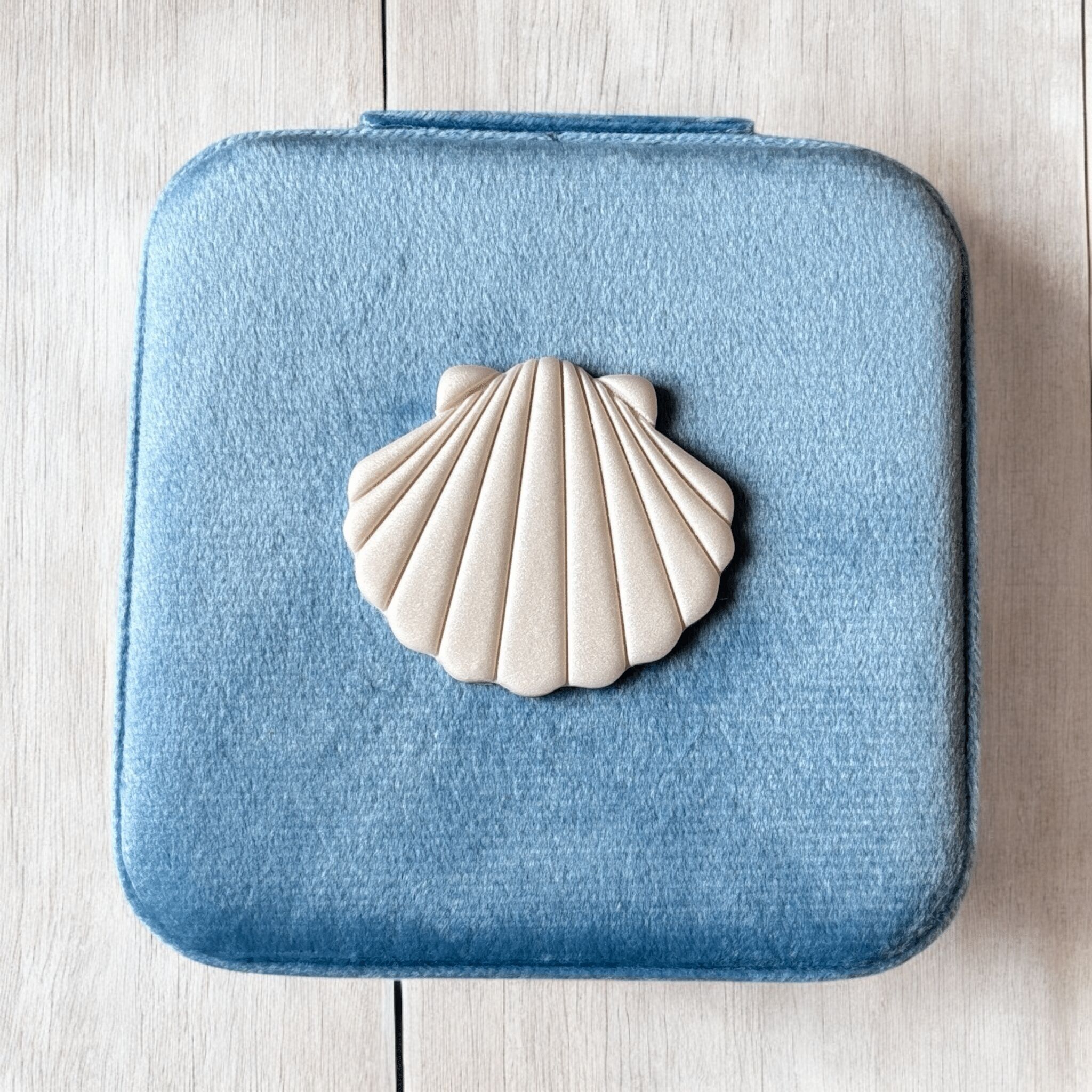 Portagioie da viaggio azzurro con Conchiglia bianca