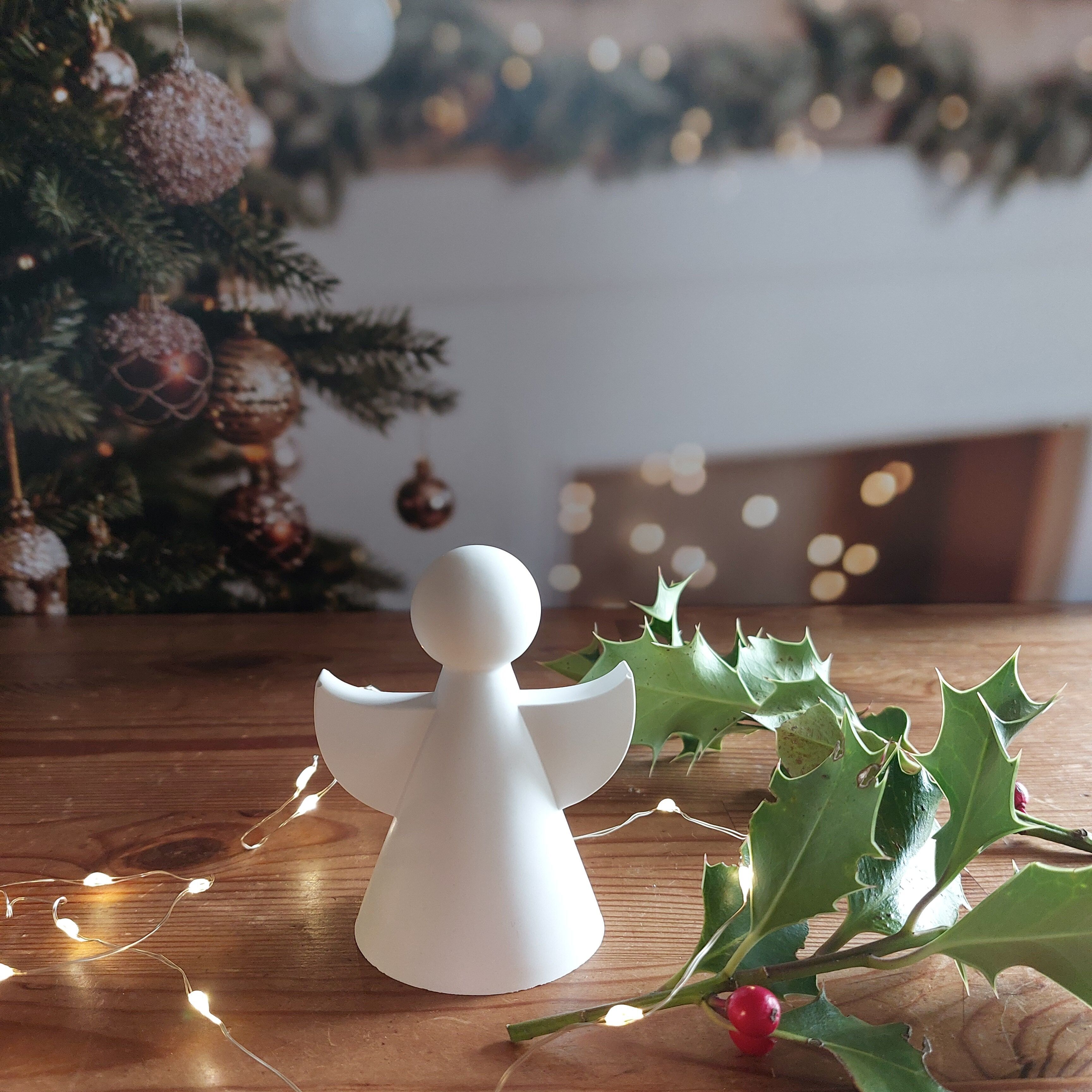 Modern white ceramic cherub, clean and minimalist style