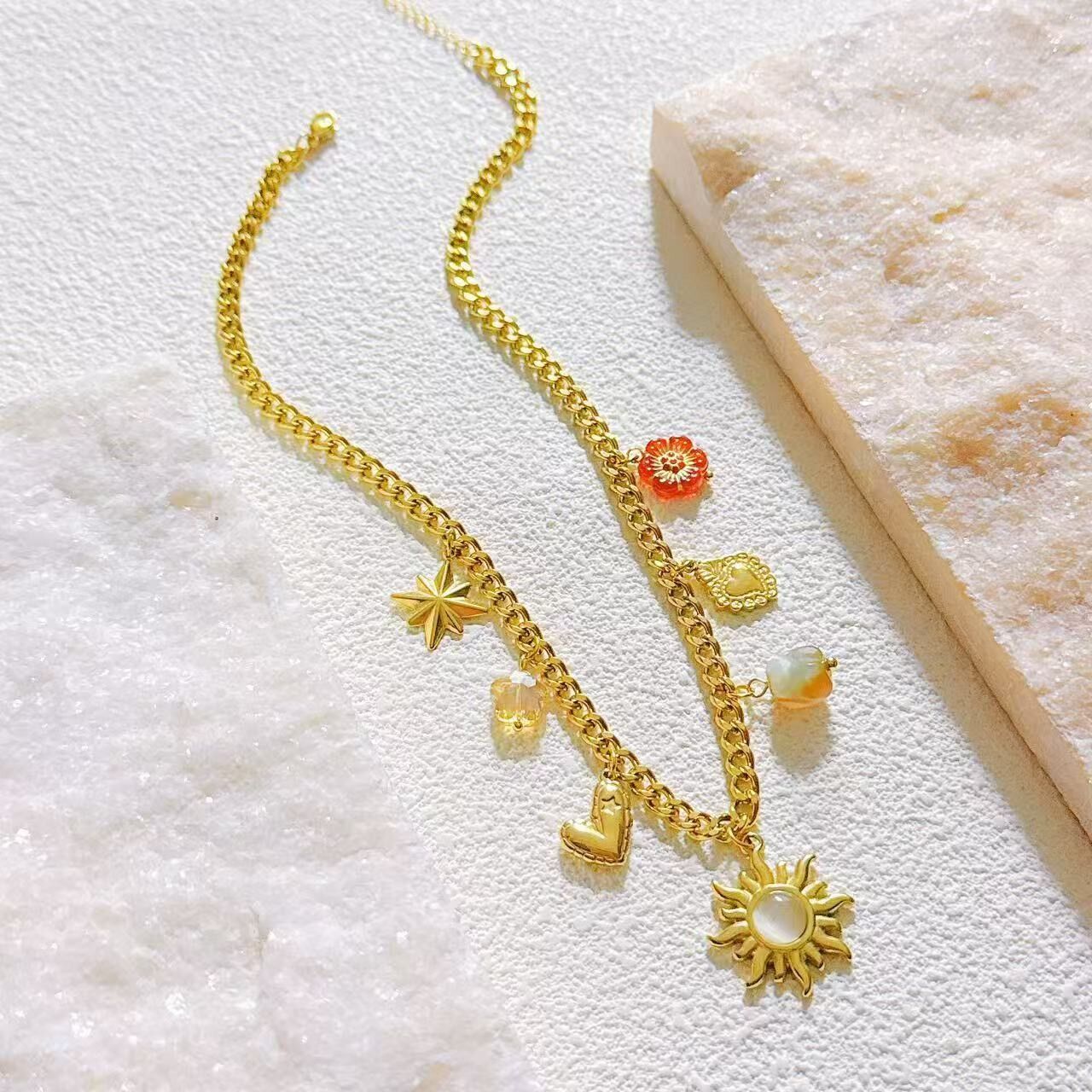 Edelstahlkette mit Sonnenanhängern