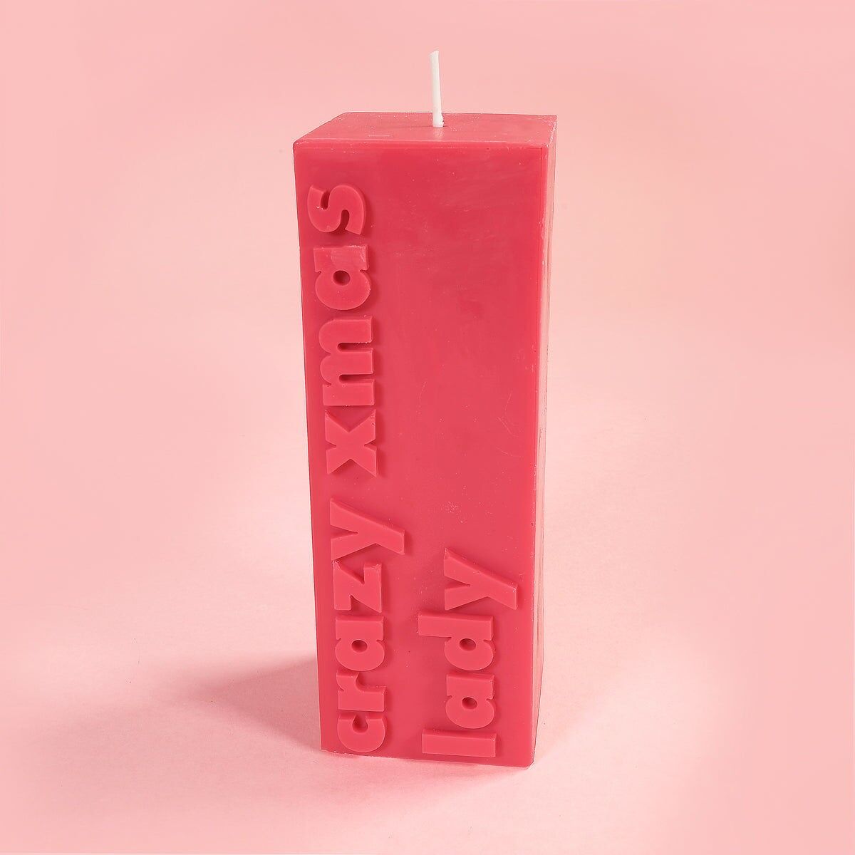 Vela de pilar con lema navideño de Crazy Xmas Lady