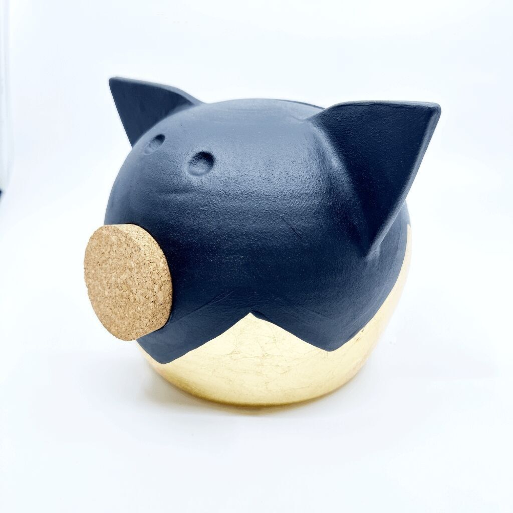 Salvadanaio in oro diviso