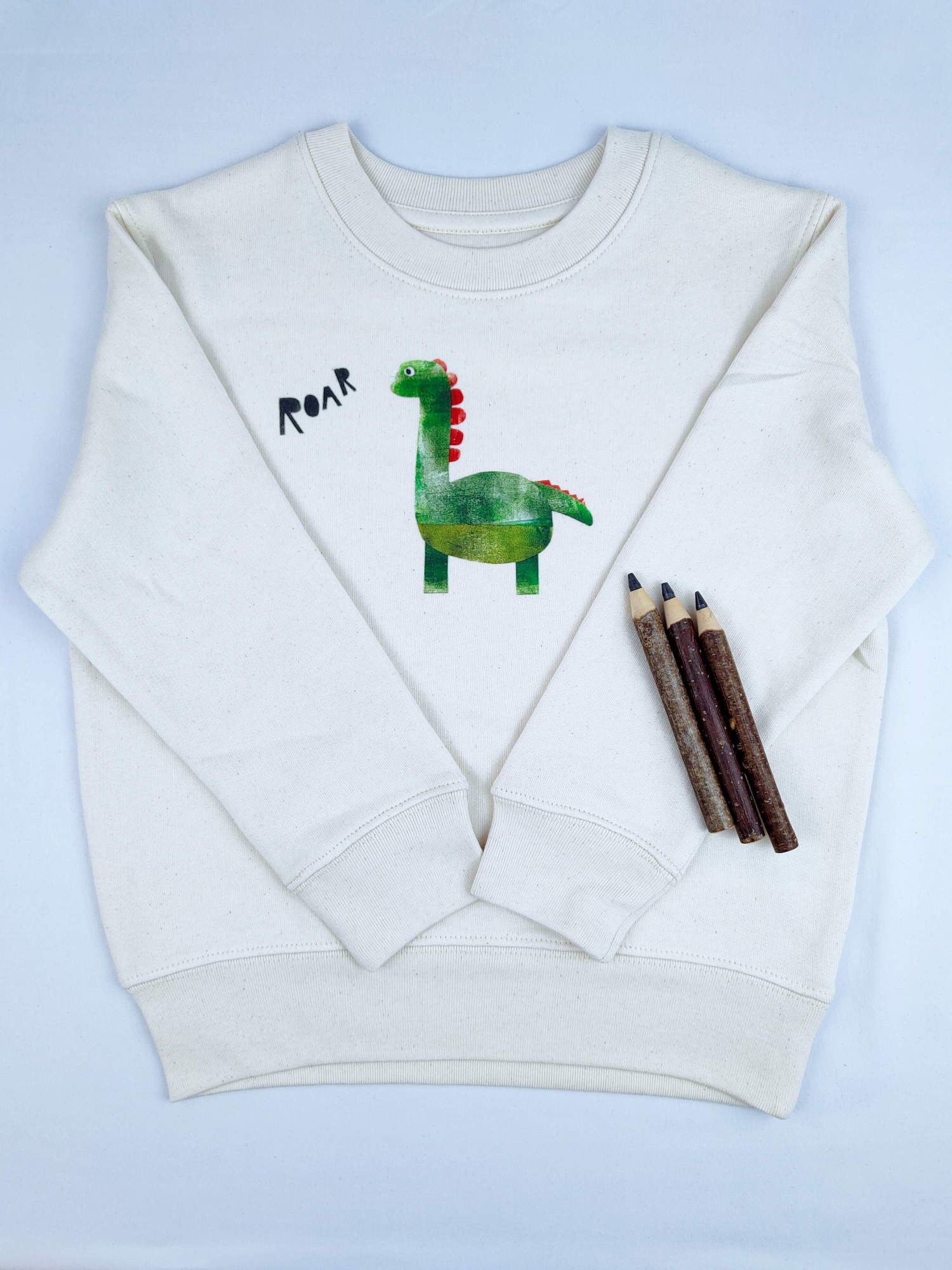 Maglione in cotone biologico per bambini Meladi - Dino su tessuto grezzo naturale