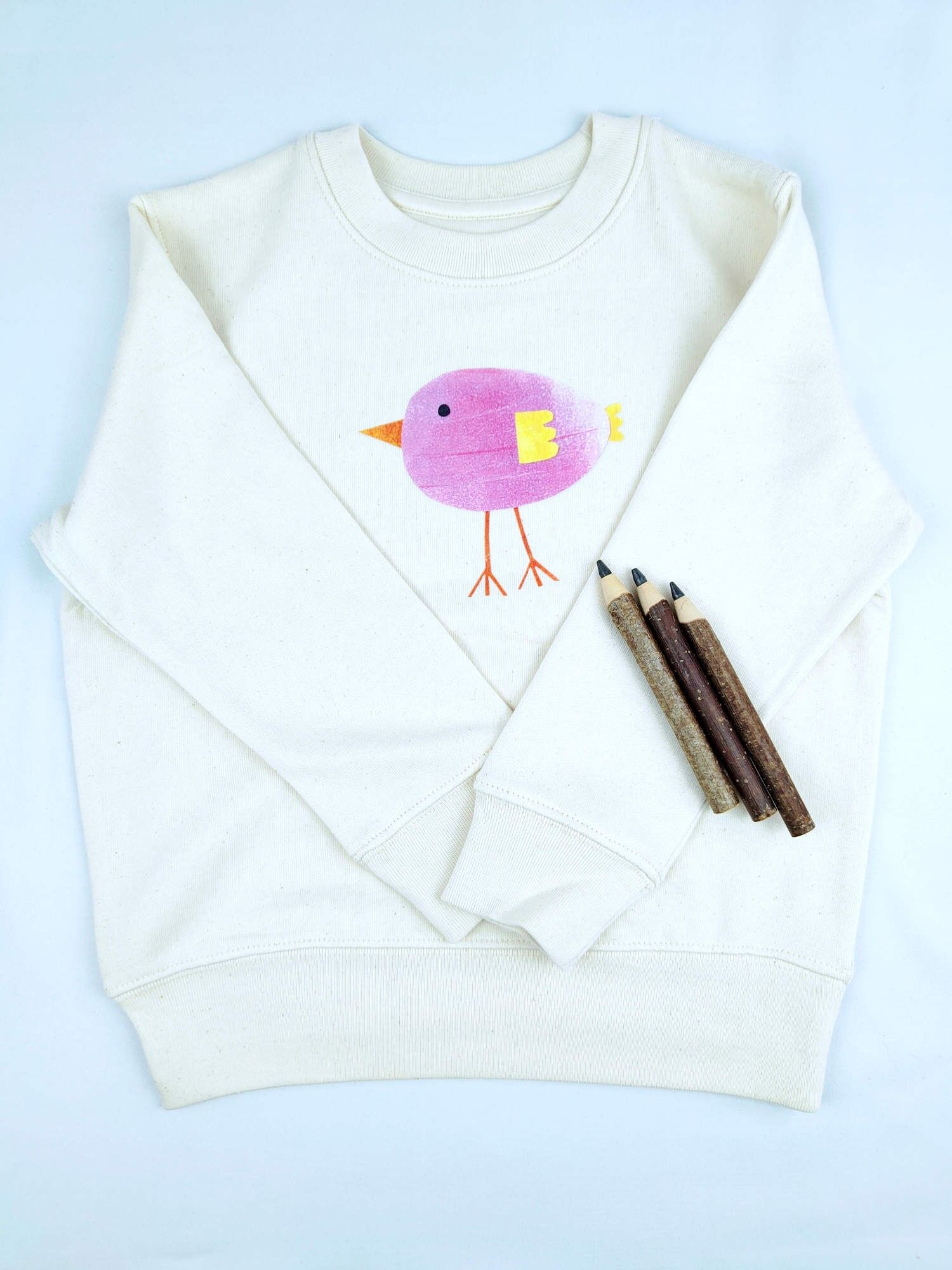 Maglione in cotone biologico per bambini Meladi - Uccello viola su tessuto grezzo naturale