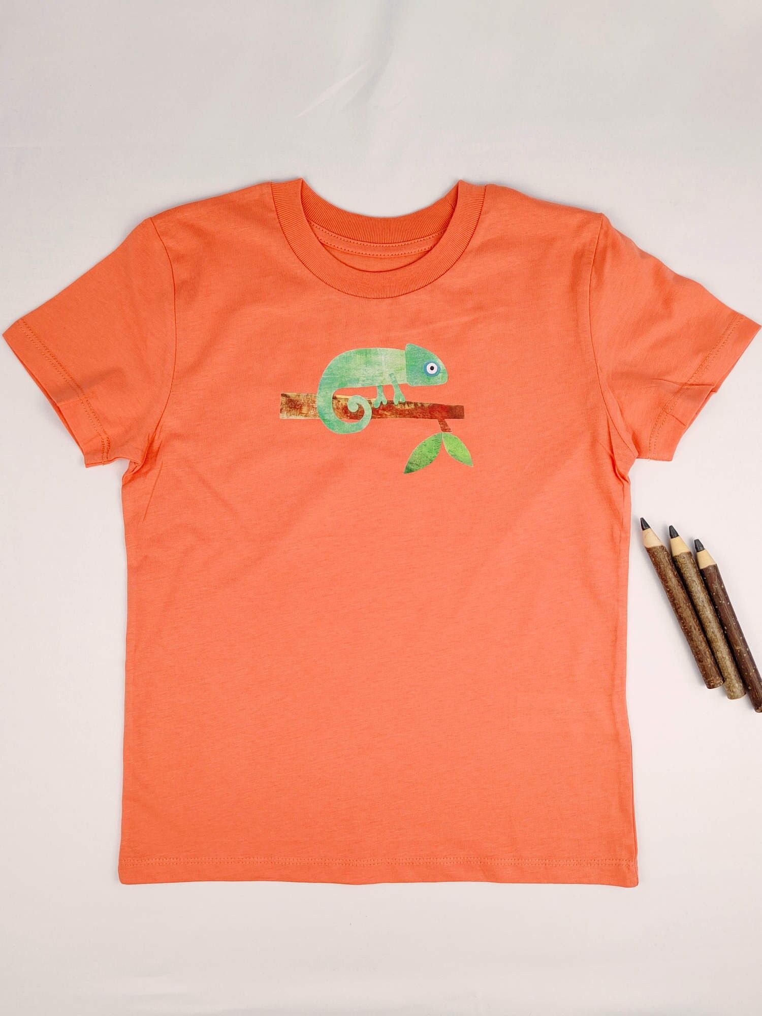 Maglietta per bambini Meladi in cotone biologico - Camaleonte su arancione
