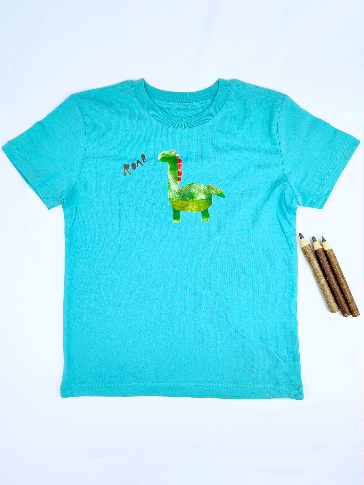 Maglietta per bambini Meladi in cotone biologico - Dino su turchese