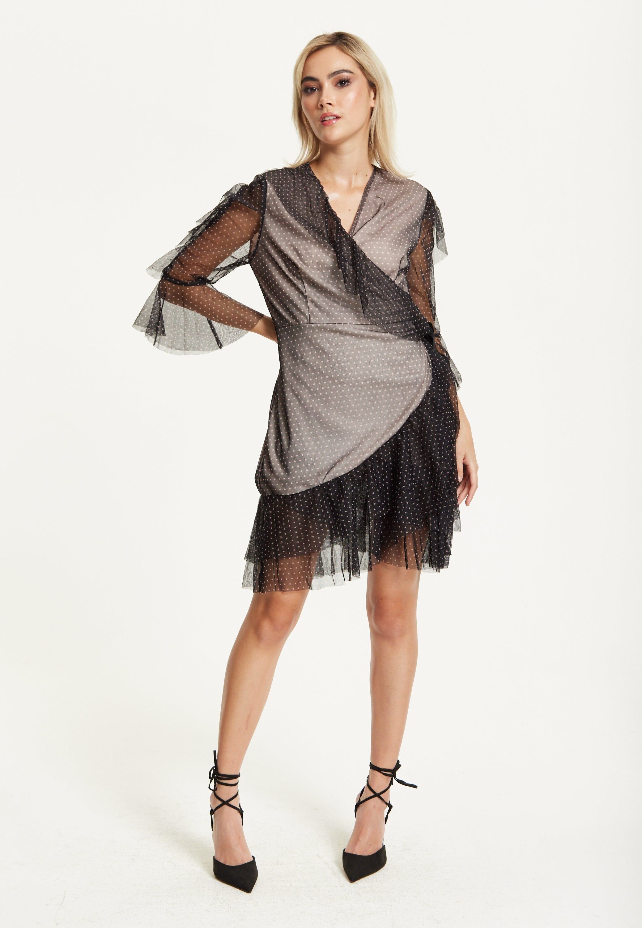 Abito a rete avvolgente a pois neri