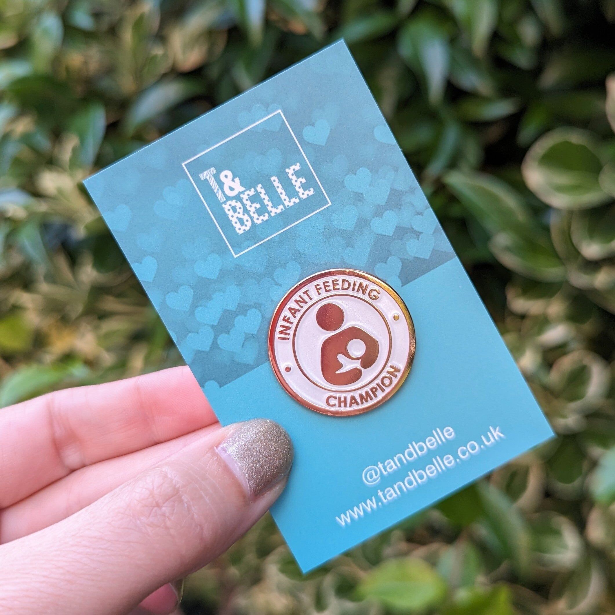 Pin's en émail « Champion de l'allaitement maternel » - Or rose et perle