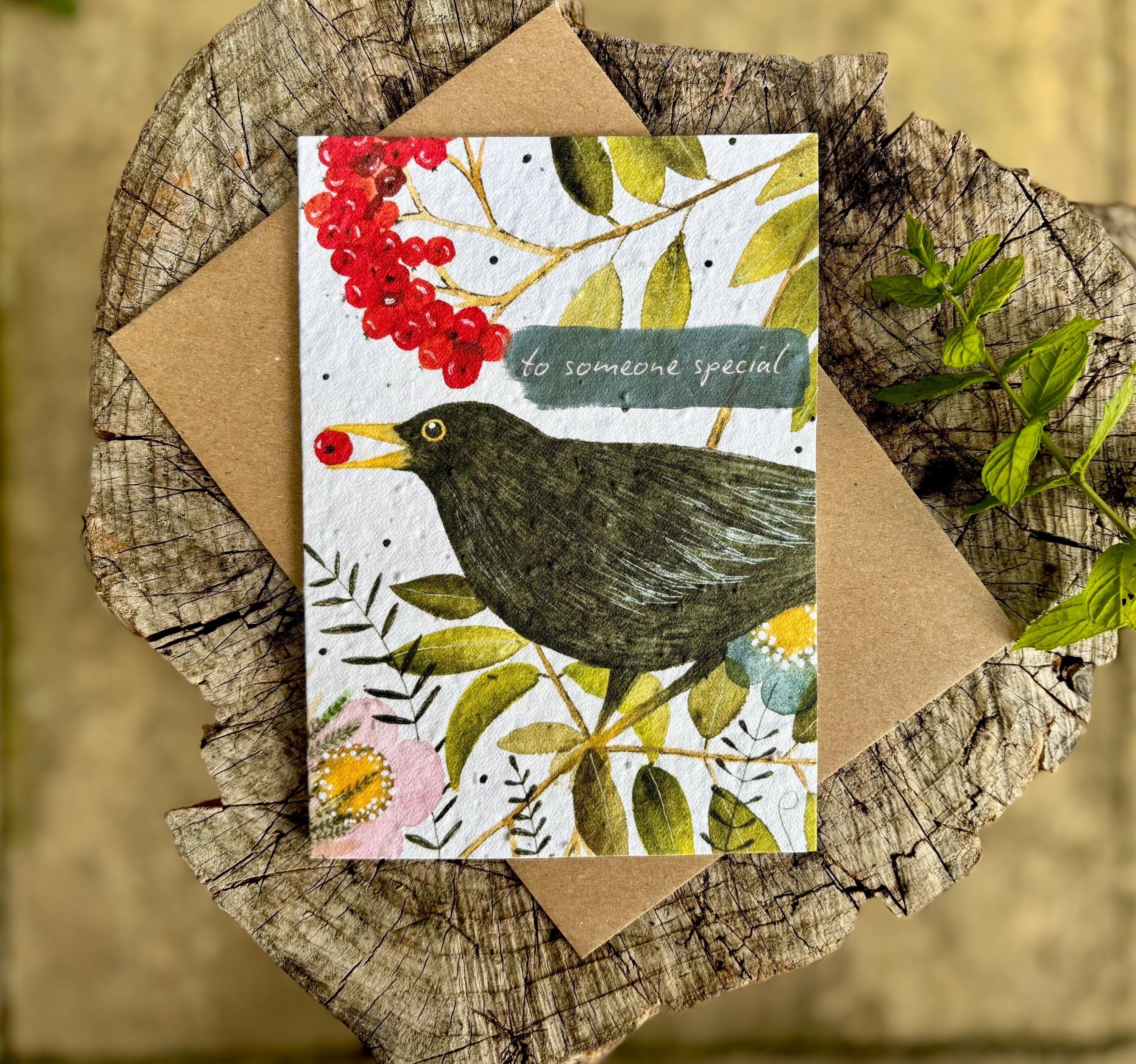 Biglietto di auguri di compleanno con semi piantumabili: motivo floreale con uccellino nero