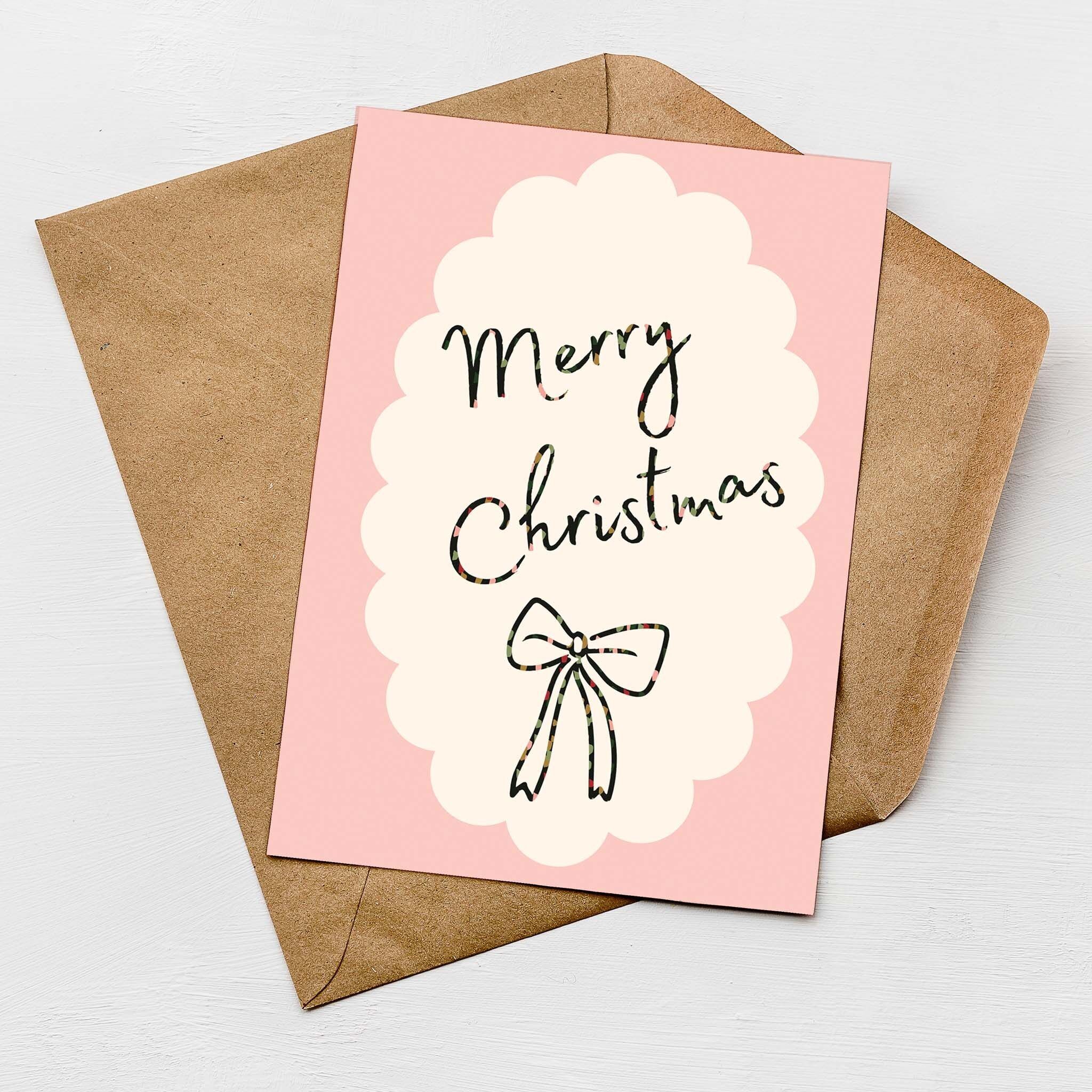 Carte de vœux « Joyeux Noël » avec nœud rose | Carte festive avec nœud rose