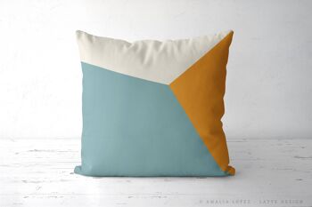 Coussin décoratif géométrique blanc et bleu sarcelle 1