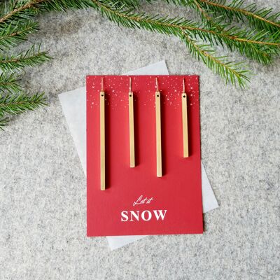 Adornos para árboles de Navidad con una tarjeta regalo.