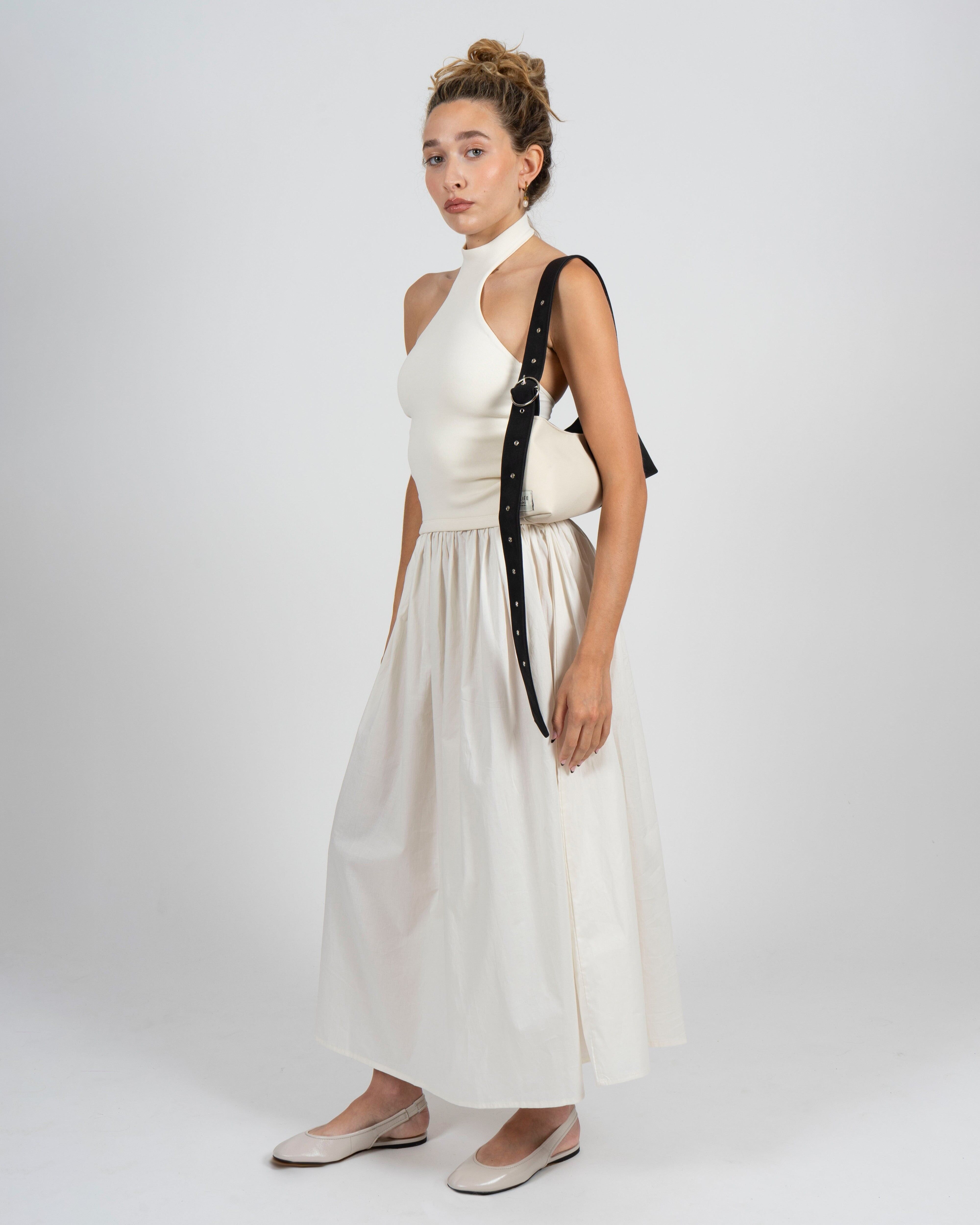 Bolso baguette blanco y negro con correa ajustable y hebilla plateada – Gala
