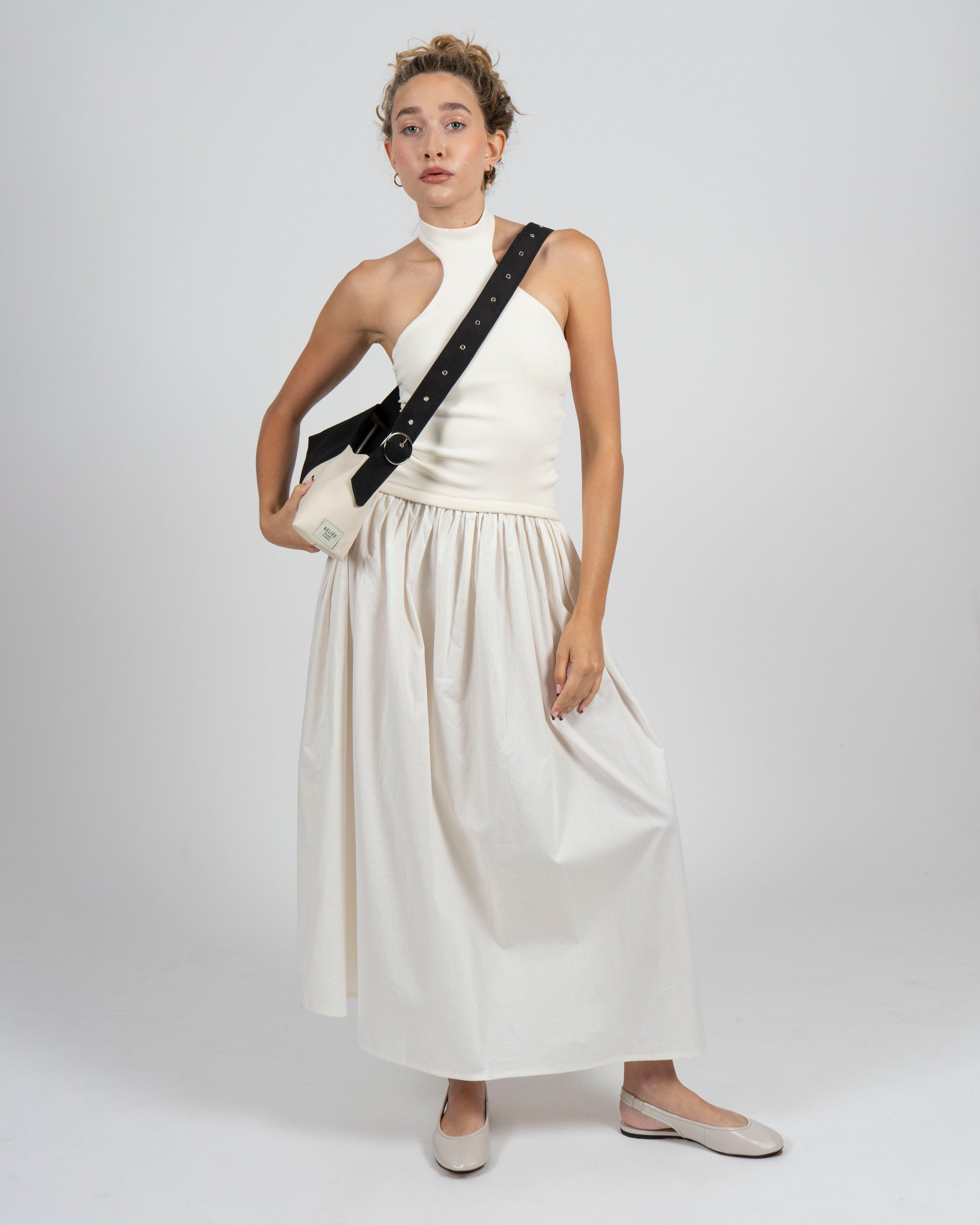 Bolso baguette blanco y negro con correa ajustable y hebilla plateada – Gala