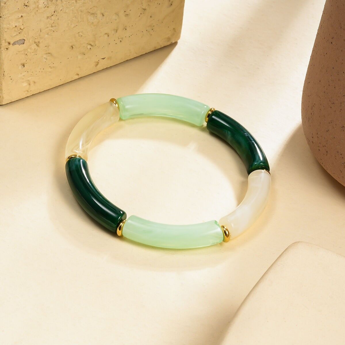 Bracciale elastico in resina nei colori verde chiaro, verde scuro e avorio