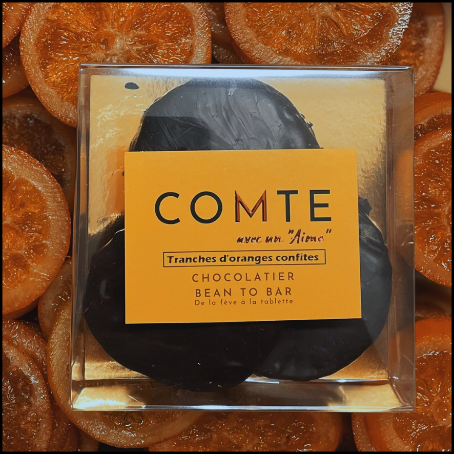 Candied orange slices coated in 76% Brazilian cocoa dark chocolate