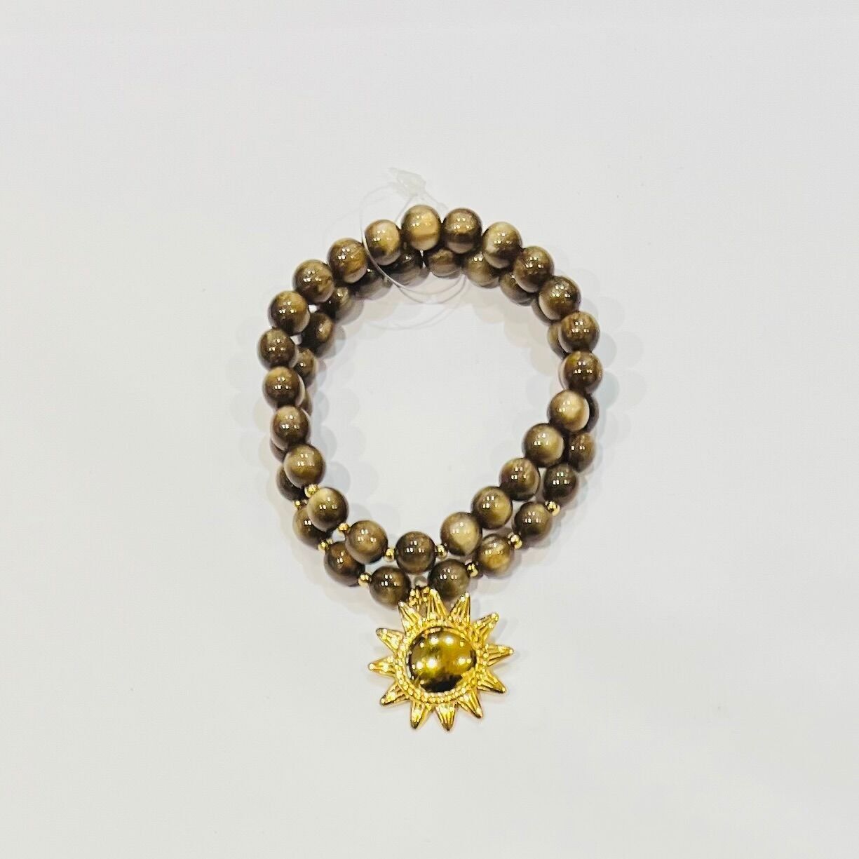 Bracciale in acciaio con perle occhio di gatto e ciondolo sole