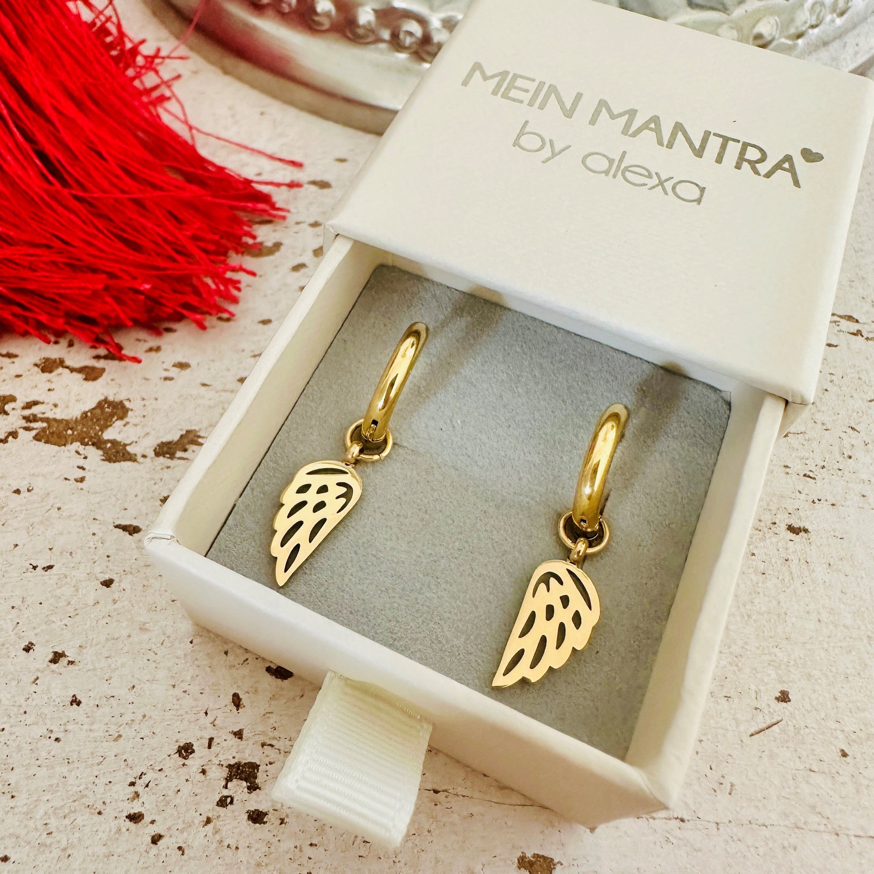 Orecchini a cerchio con ali