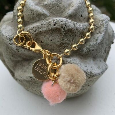 Ball bracelet in gold with pompoms
