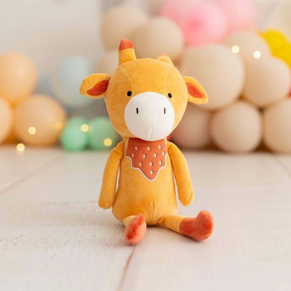 Bambola di stoffa a forma di giraffa arancione