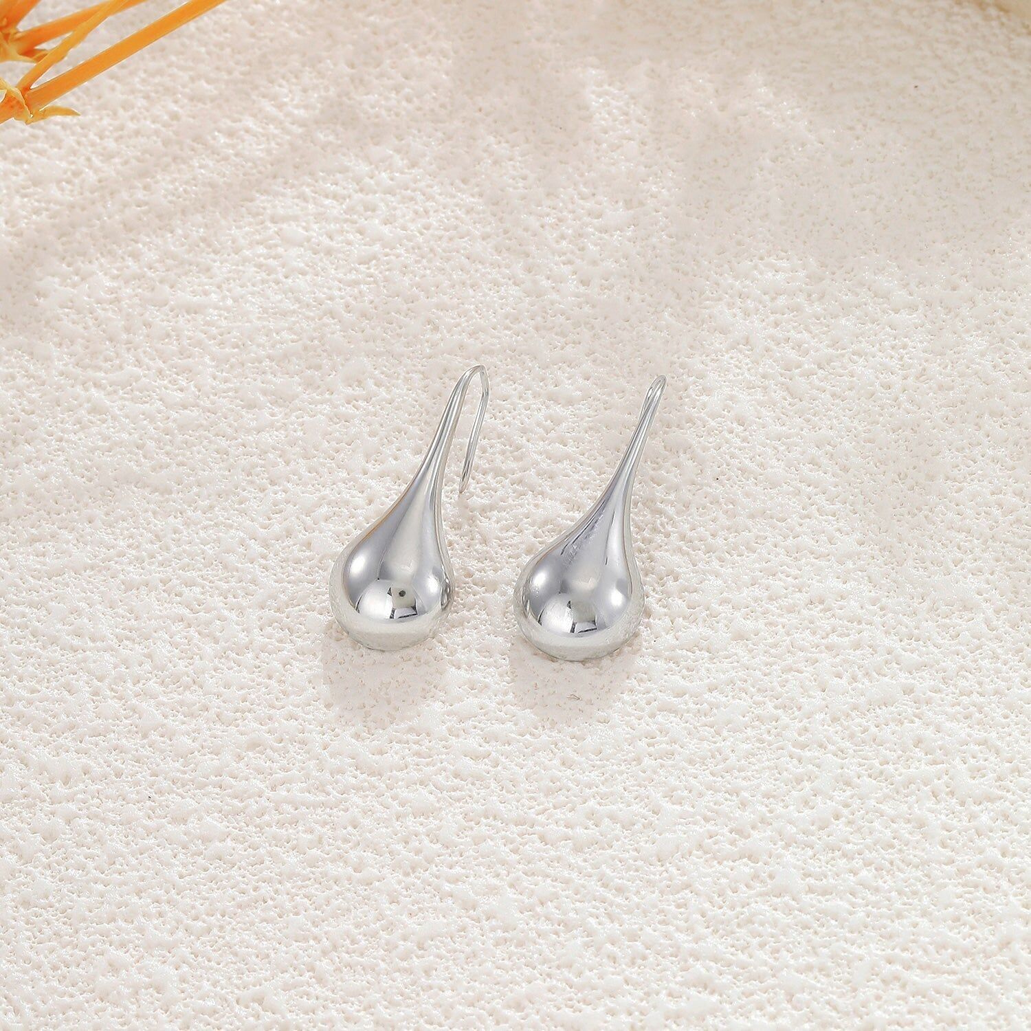 Orecchini pendenti in argento con effetto specchio