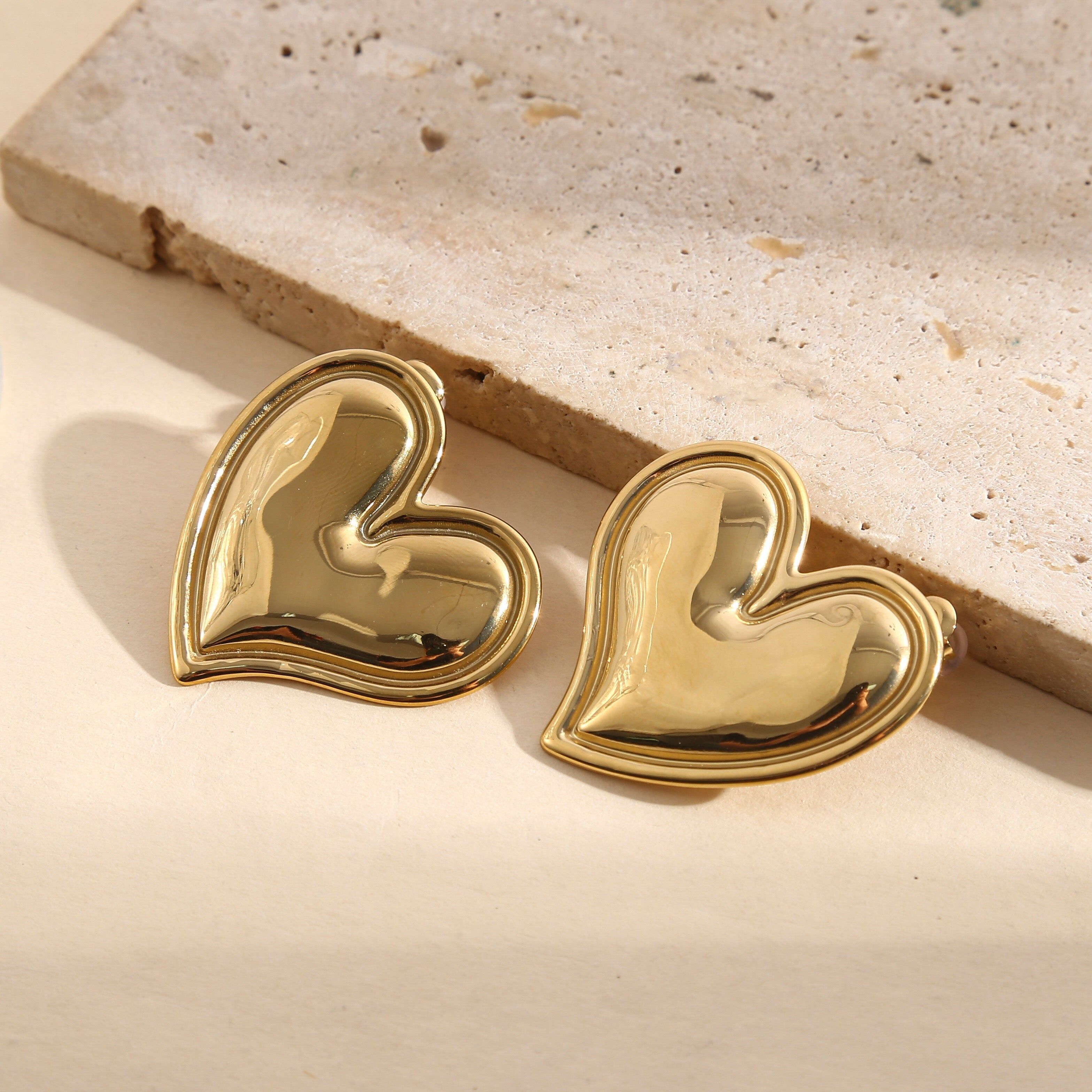 Orecchini a forma di cuore color oro con effetto specchiato