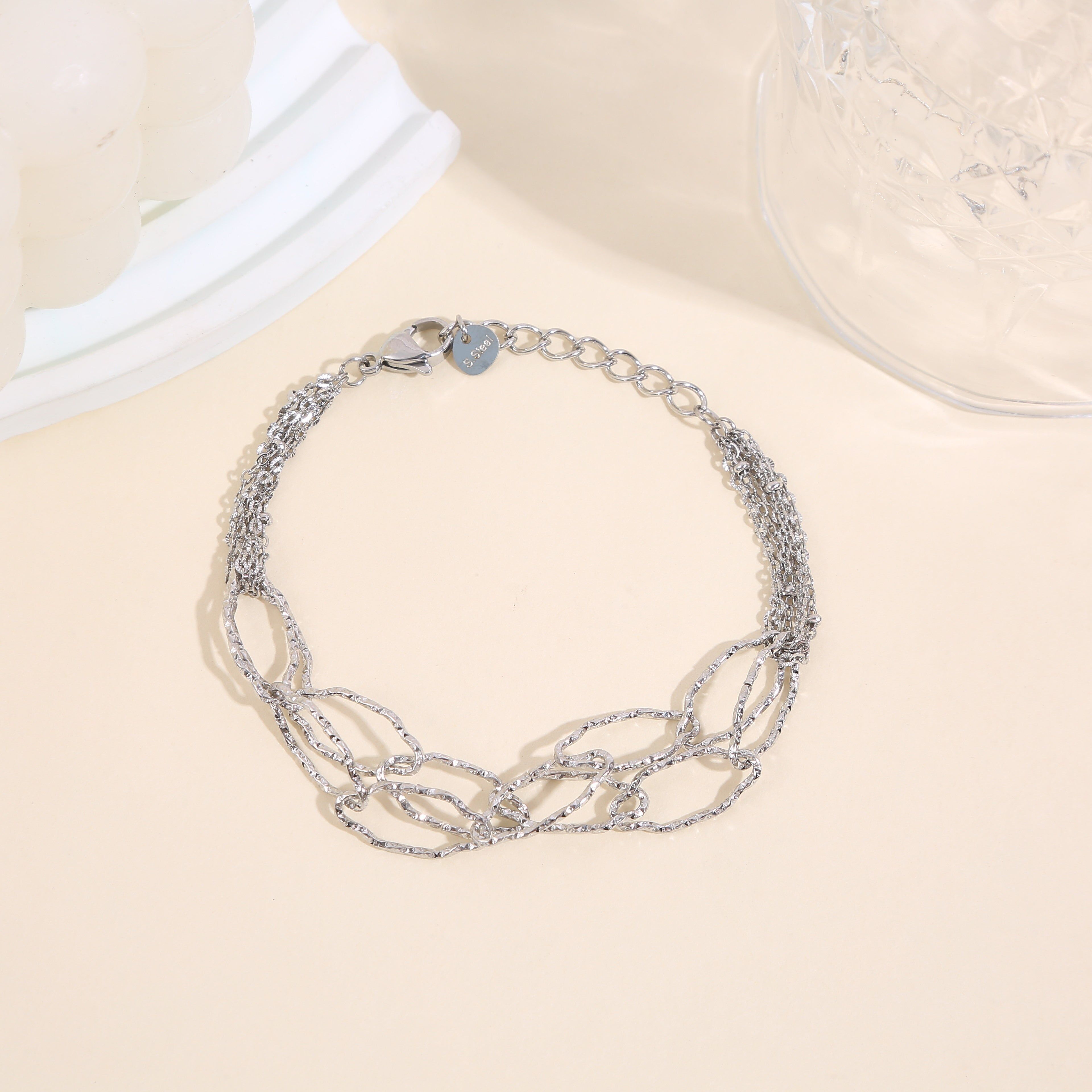 Bracciale multicatena in argento con grandi maglie martellate intrecciate