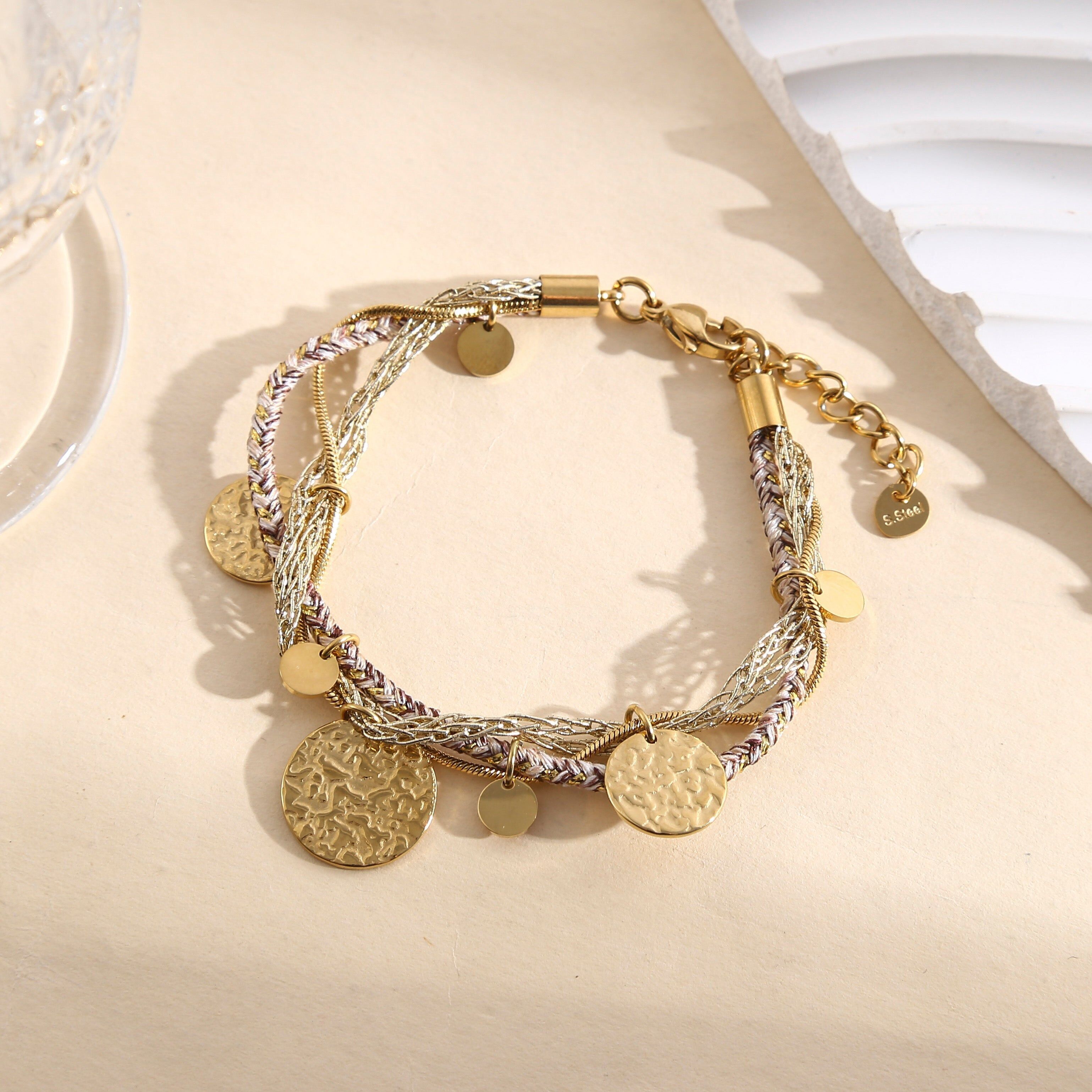 Bracciale multicatena in oro e argento con ciondoli rotondi martellati