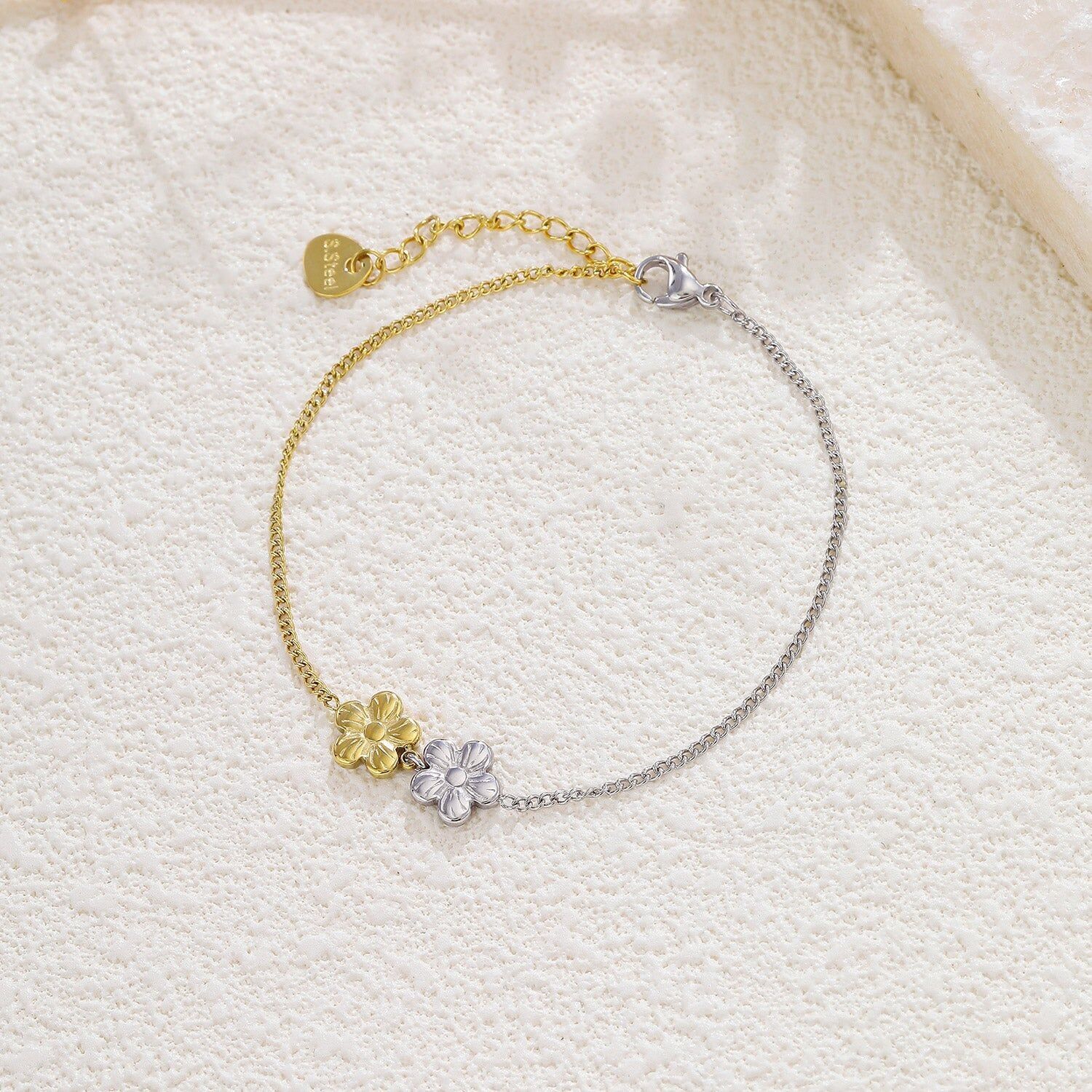 Bracciale bicolore in argento e oro con fiori a 5 petali