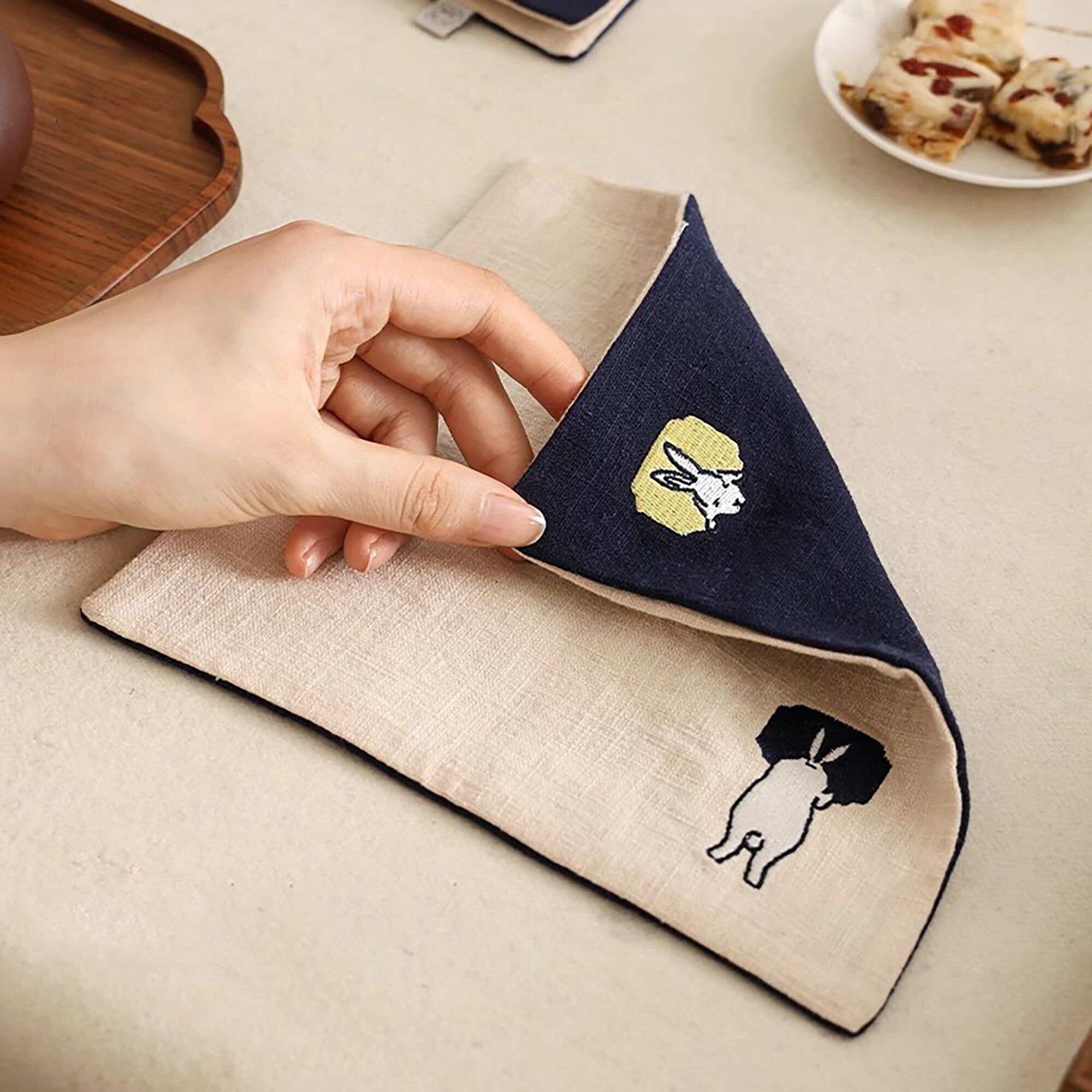 Linen and cotton tea towel with rabbit embroidery