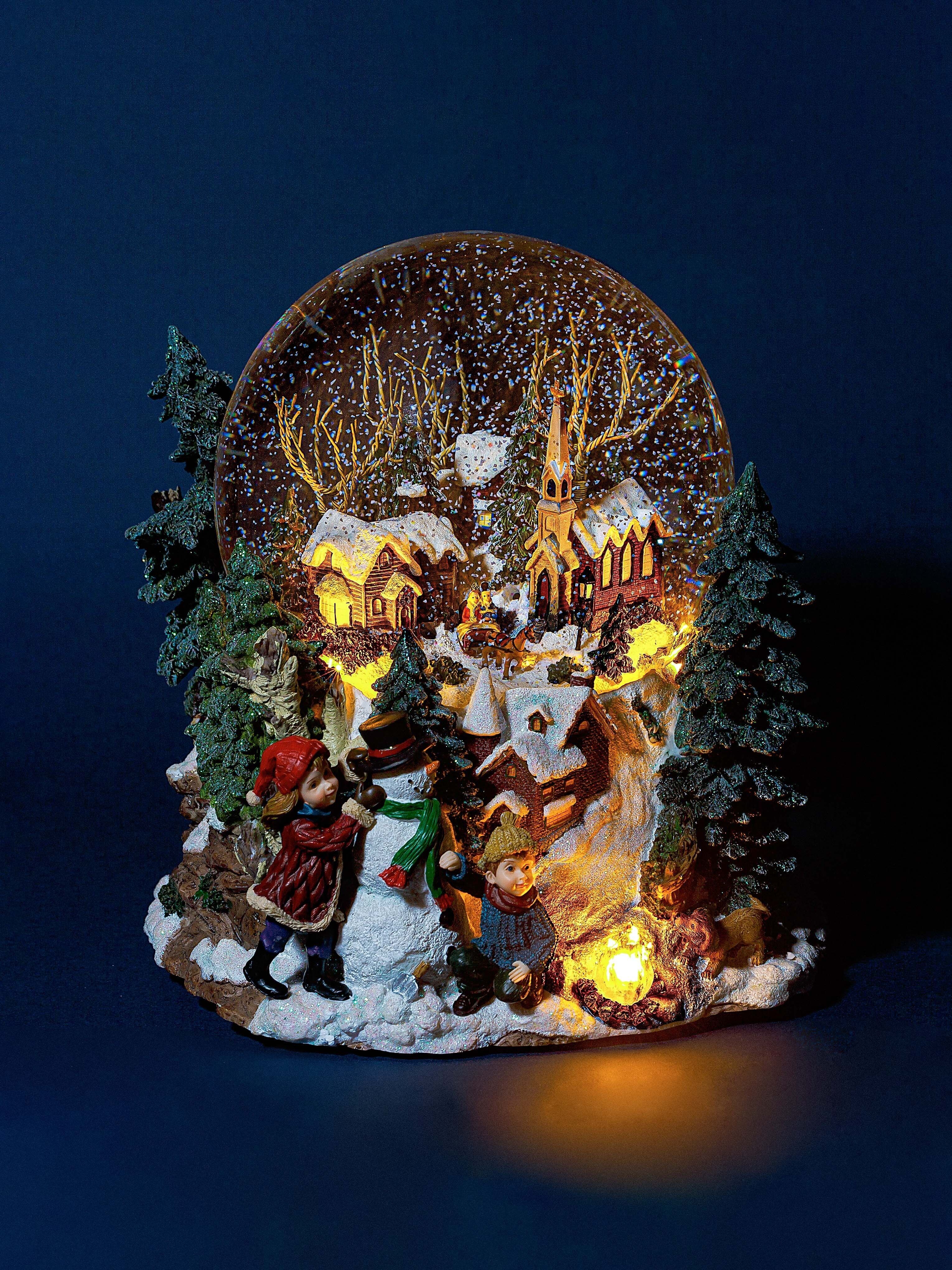 Magnificent giant musical and illuminated Christmas snow globe with swirling snow